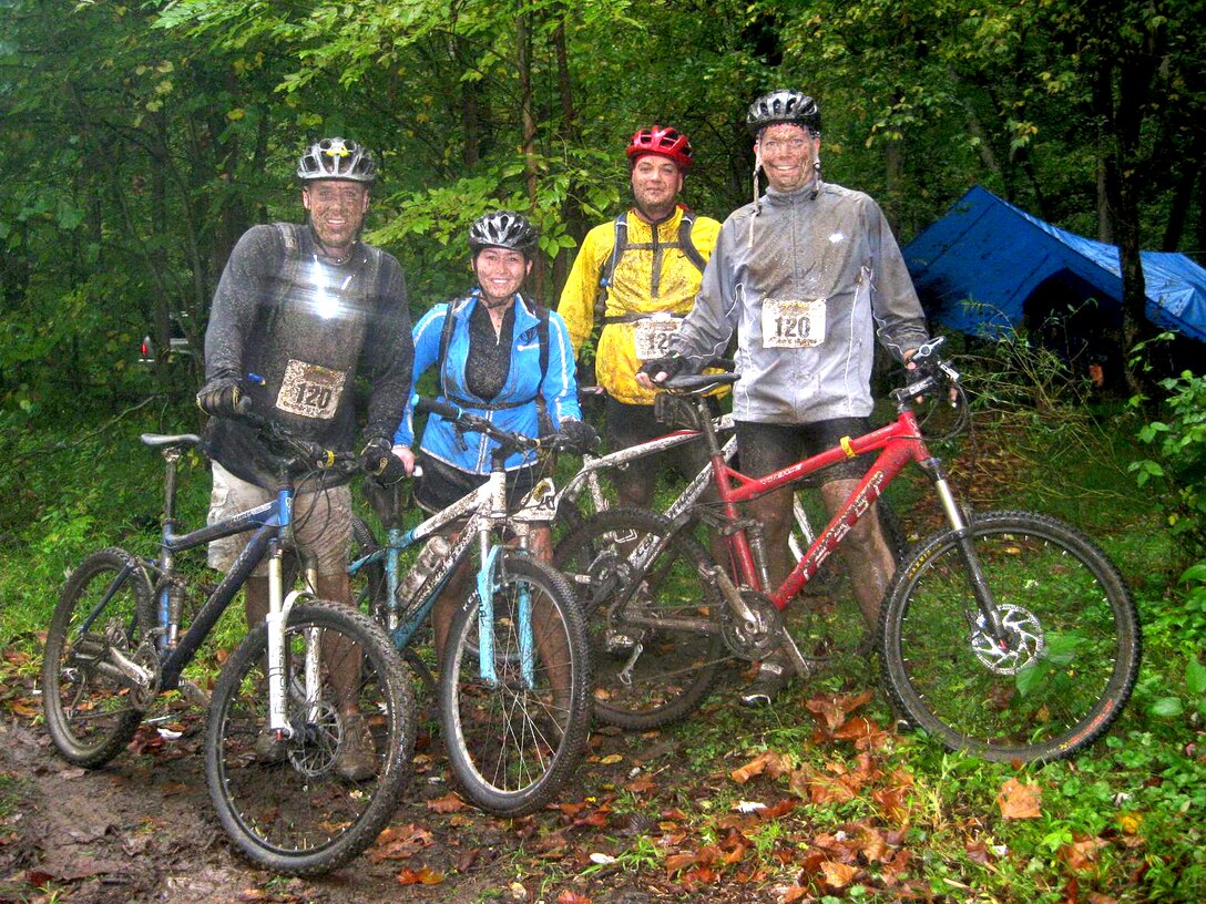 LANGLEY AIR FORCE BASE, Va. – Lt. Col. Clay Seale, 1st Aircraft Maintenance Squadron commander, 1st Lt. Karen Mostellar, 1st Maintenance Group quality assurance officer, Master Sgt. Mike Kilgore, 1st AMXS first sergeant, and Maj. Dale Robertson, 1st AMXS operations officer, complete a 14-mile mountain bike race in the heart of the Appalachian Mountains Oct. 9. More than fifty teams, from all branches of the armed forces, competed in the three-day 9th Annual Wilderness Challenge on the New and Gauley rivers in West Virginia. (U.S. Air Force/courtesy photo)
