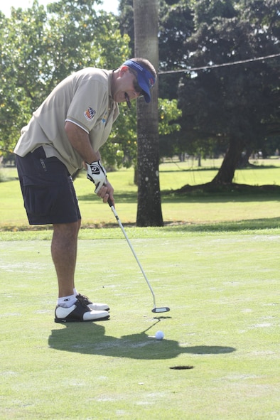 Senior Master Sgt. Tony Romero concentrates as participates in the 40th Annual Military Affairs Committee Golf Tournament on Oct. 9. (U.S. Air Force photo/Senior Airman Lou Burton)