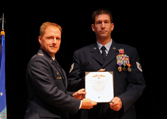 Tech. Sgt. Michael Williams was awarded the Bronze Star Medal with Valor, the Purple Heart, the Army Commendation Medal and the Air Force Combat Action Medal by Col. John Wood at the Charleston AFB theater Oct. 15. These medals are awarded to service members who have distinguished themselves through heroic and meritorious actions. Sergeant Williams is an explosive ordnance technician with the 437th Civil Engineer Squadron and Colonel Wood is the 437th Airlift Wing commander. (U.S. Air Force photo/Senior Airman Katie Gieratz)