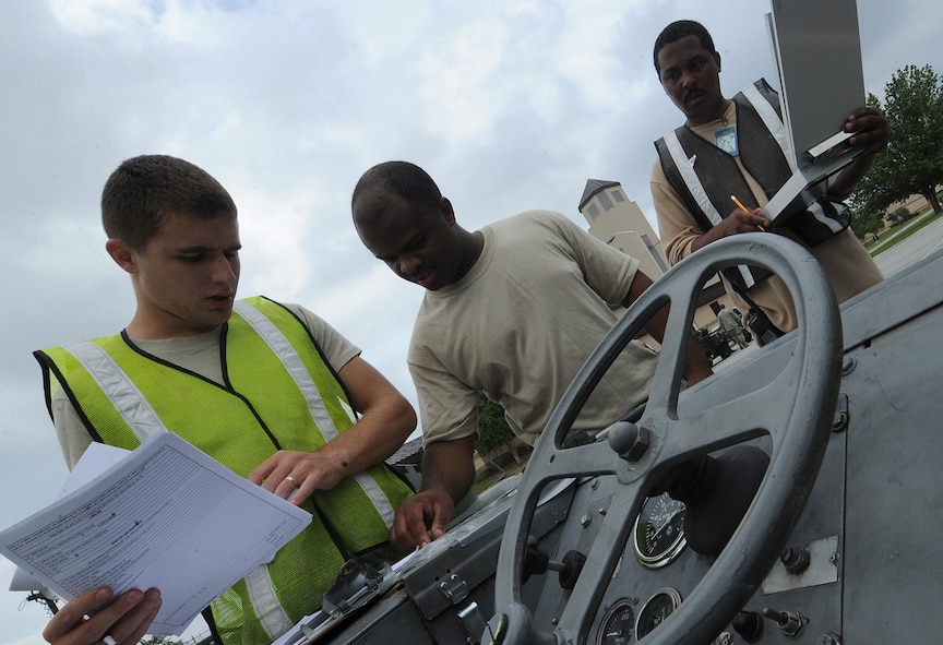 MOODY AIR FORCE BASE, Ga. -- Airman 1st Class Tanner Bryan, 23rd Logistics readiness squadron traffic management journeyman, Senior Airman Wardell Mayfield, 23rd LRS vehicle maintenance journeyman, and Dave Talley, 23rd LRS traffic management officer, ensure the weight and measurement of equipment is accurate during the Phase I Operational Readiness Exercise here Oct. 14. (U.S. Air Force photo by Staff Sgt. Elizabeth Rissmiller)