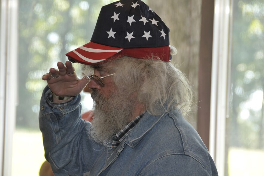 Richard Binkley, a U.S. Marine Corp veteran, salutes the American flag during the presentation of colors as the annual VA Picnic at AEDC got underway.  Binkley lives in Murfreesboro. (Photo by Rick Goodfriend)