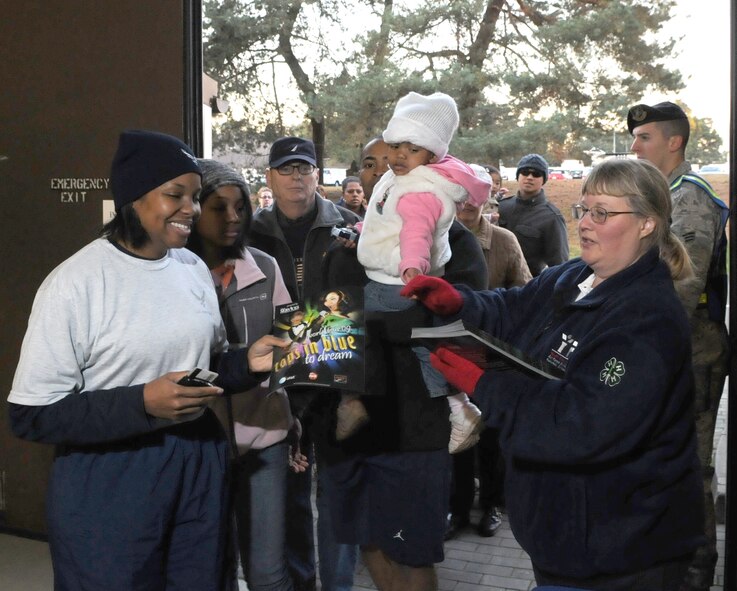 Members assigned in the Kaiserslautern local community quickly filled an entire aircraft hangar in anticipation of the Tops in Blue performance October 15, 2009, Ramstein Air Base Germany.  Tops in Blue put on an amazing performance on October 15, 2009, Ramstein Air Base Germany, but it wouldn't have been possible without numerous of volunteers headed by members of the 86th Services Squadron.  (U.S. Air Force Photo by: Tech. Sgt. Sean M. White)