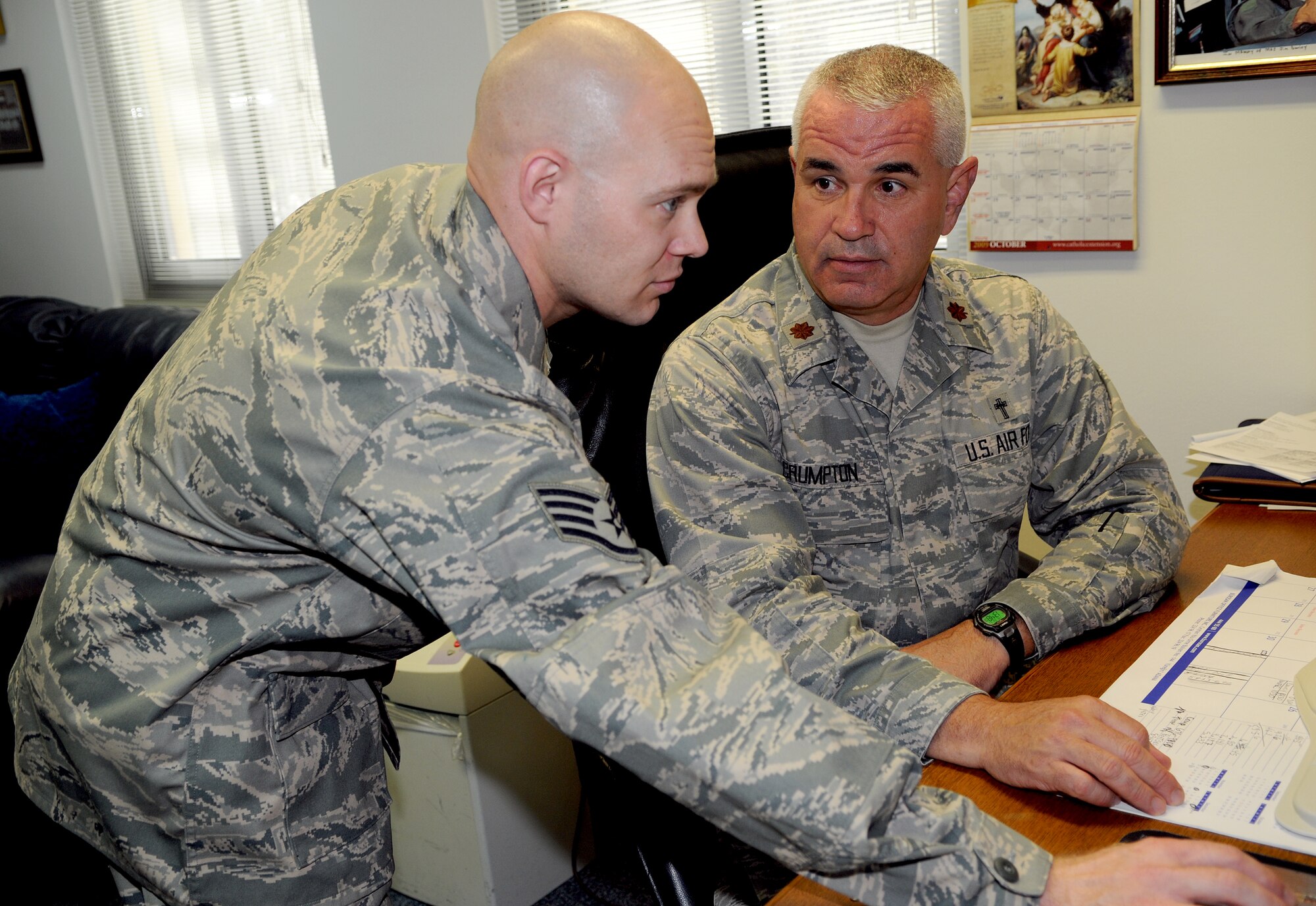 Staff Sgt. Joseph Gibbon, a 39th Air Base Wing chaplain assistant, assists Chaplain (Maj.) Mark Crumpton, the 39th ABW chaplain, with administration work at the base chapel Thursday, Oct. 15, 2009, at Incirlik Air Base, Turkey. Chaplain assistants are often the "eyes and ears" of chaplains on deployments, visitations and other events. (U.S. Air Force photo/Senior Airman Alex Martinez)