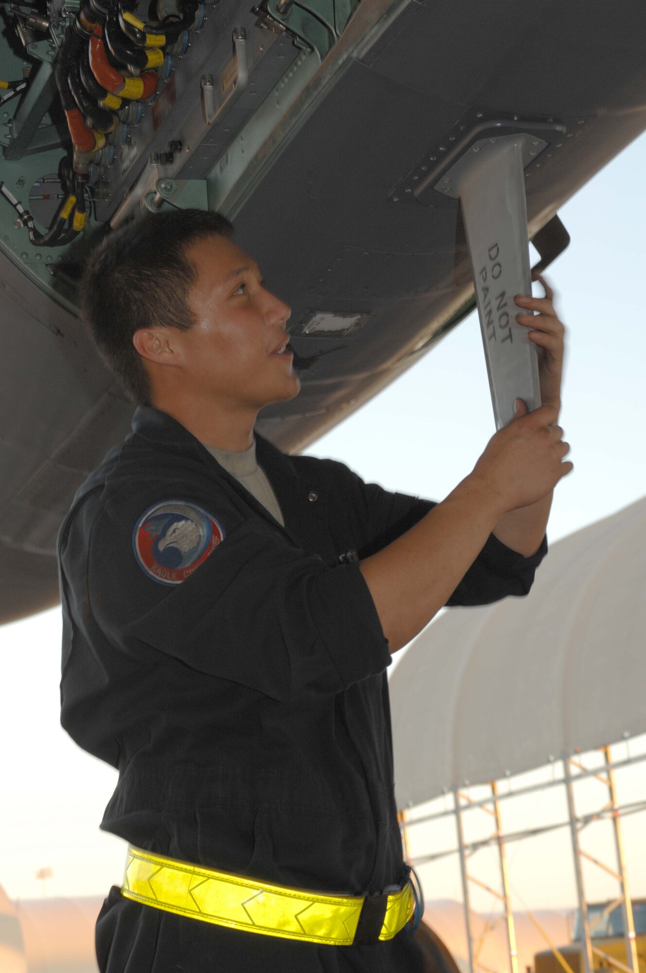 Airman 1st Class William Mckinney, 4th Aircraft Maintenance Squadron crew chief, conducts a post flight inspection of wire systems on an F-15E Strike Eagle at Seymour Johnson Air Force Base, N.C., Oct. 7, 2009. Crew chiefs perform inspections on Strike Eagles according to a computerized checklist designed by Boeing, who created the F-15E. The checklist provides detailed instructions on repairing the aircraft. (U.S. Air Force Photo/Airman 1st Class Marissa Tucker)