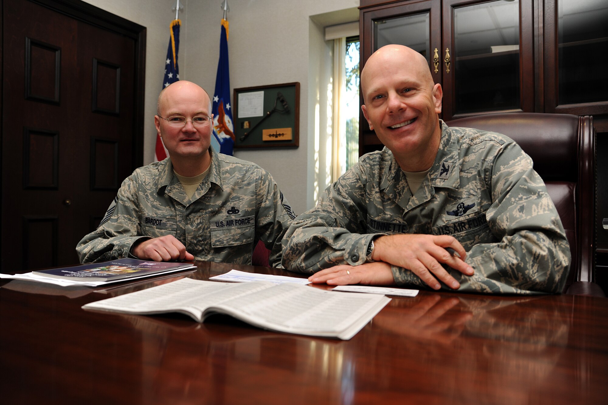 Col. Tip Stinnette, U.S. Air Force Expeditionary Center vice commander, works with Senior Master Sgt. Eugene Bardot, Mobility Operations School instructor, to donate to the Combined Federal Campaign (CFC) Oct. 14 on Joint Base McGuire-Dix-Lakehurst. The mission of the CFC is to promote and support philanthropy through a program that is employee focused, cost-efficient, and effective in providing all federal employees the opportunity to improve the quality of life for all.  CFC is the world?s largest and most successful annual workplace charity campaign, with more than 300 CFC campaigns throughout the country and internationally to help to raise millions of dollars each year.  Pledges made by Federal civilian, postal and military donors during the campaign season support eligible non-profit organizations that provide health and human service benefits throughout the world.  Airmen can find more information about CFC through their unit representatives.  (U.S. Air Force Photo/Staff Sgt. Nathan G. Bevier)