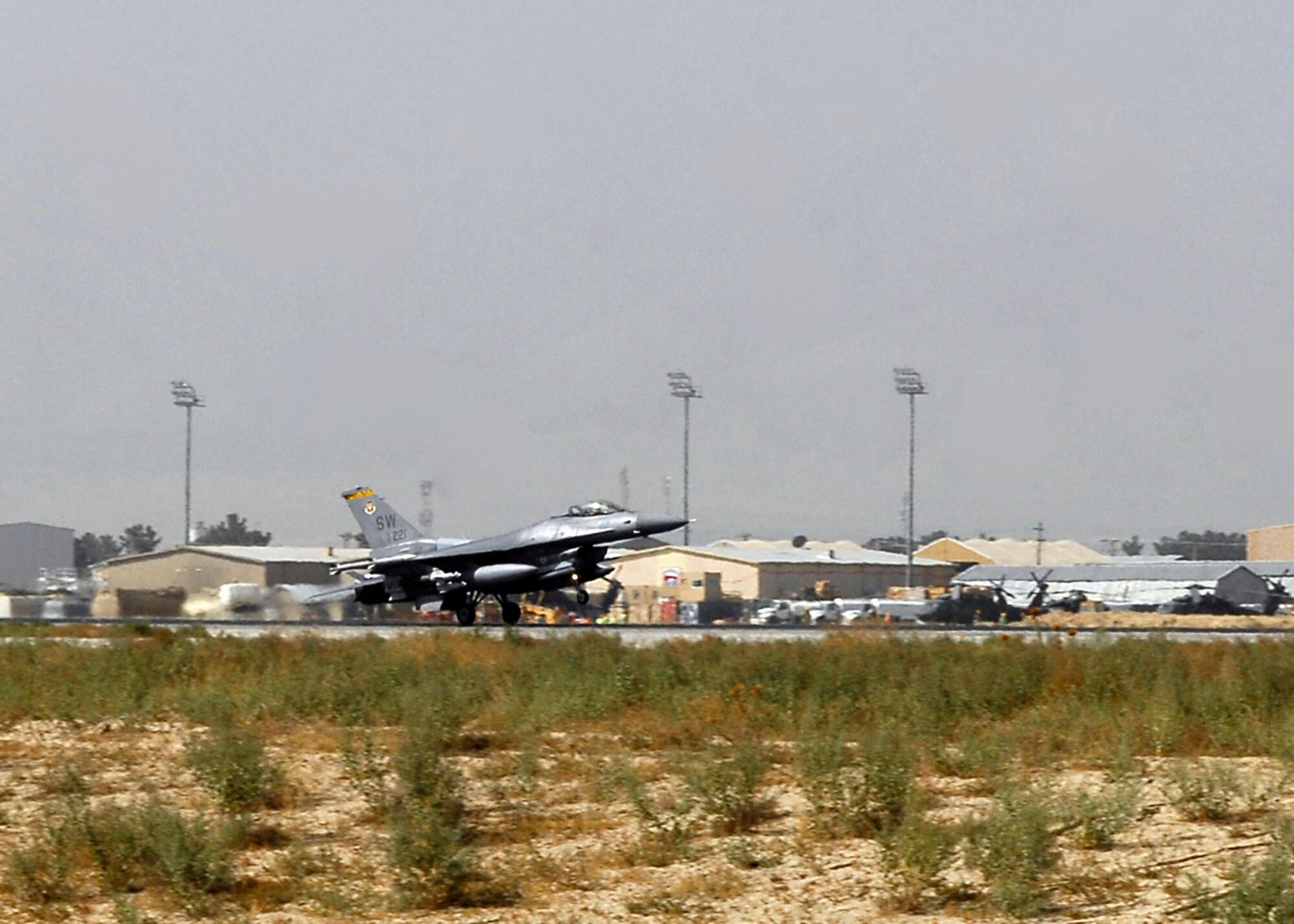 BAGRAM AIRFIELD, Afghanistan -- An F-16 Fighting Falcon, from the 79th Expeditionary Fighter Squadron, lands on the flightline after fulfilling a mission in support of Operation Enduring Freedom here, Oct. 16, 2009.  The Falcons deployed from Shaw Air Force Base, S.C.; they are known as the "Tigers."  (U.S. Air Force photo/Senior Airman Felicia Juenke)