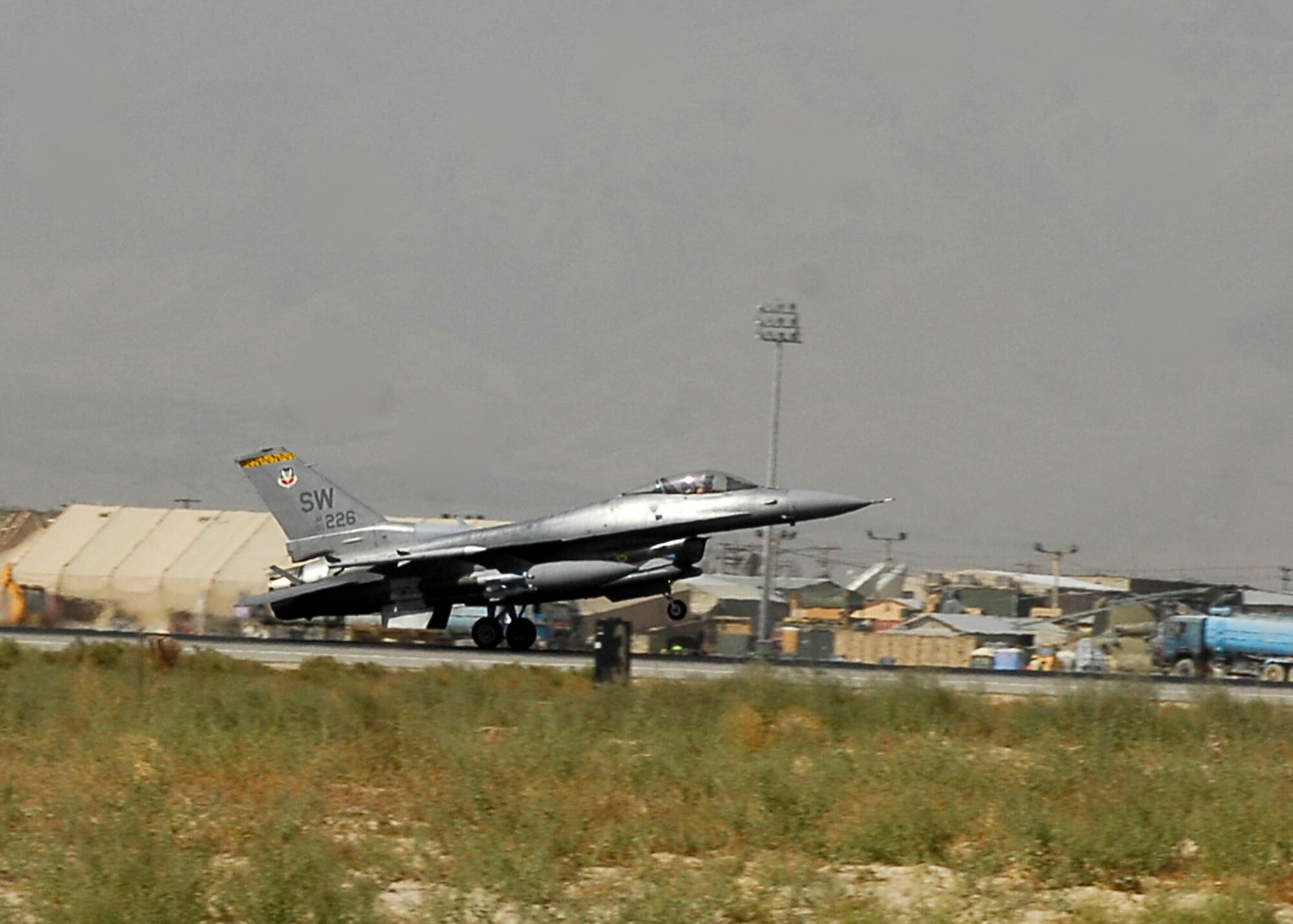 BAGRAM AIRFIELD, Afghanistan -- An F-16 Fighting Falcon, from the 79th Expeditionary Fighter Squadron, lands on the flightline after fulfilling a mission in support of Operation Enduring Freedom here, Oct. 16, 2009.  The Falcons deployed from Shaw Air Force Base, S.C.; they are known as the "Tigers."  (U.S. Air Force photo/Senior Airman Felicia Juenke)
