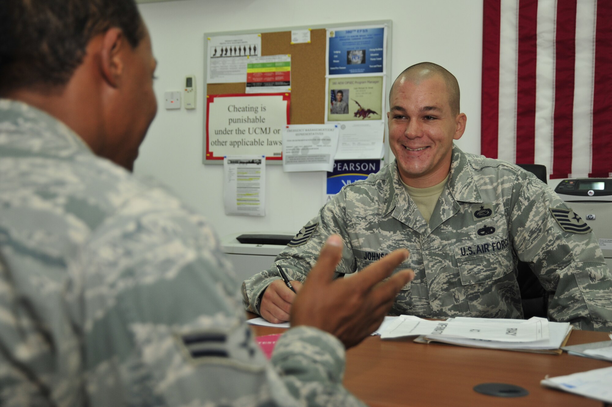 SOUTHWEST ASIA -Tech. Sgt. Eric Johnson, 380th Expeditionary Force Support Squadron test control officer, schedules a test at the education office for an Airman here Oct. 14, 2009. Sergeant Johnson is deployed from MacDill Air Force Base, Fla., and hails from Virginia Beach, Va. (U.S. Air Force photo/Tech. Sgt. Charles Larkin Sr)
