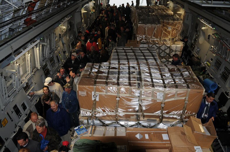 Local civic leaders, base personnel and their families tour the final C-17 Globemaster III delivered to the Heavy Airlift Wing on Oct. 12, 2009 at Papa Air Base, Hungary.  The HAW now has three C-17s available to provide a heavy airlift solution with global reach to meet national obligations to the European Union, NATO and U.N. (U.S. Air Force photo/Staff Sgt. Mercedes Crossland)