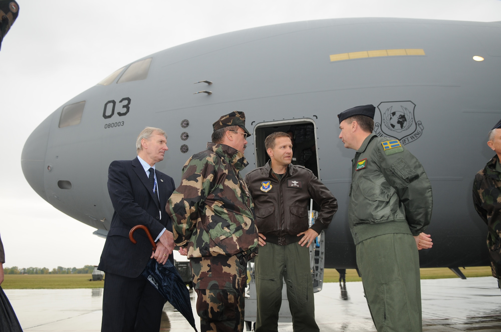 Col. John Zazworsky, Heavy Airlift Wing commander (center right), met with Swedish Col. Fredrik Heden, HAW vice commander (right), General Laszlo Tombol, Hungarian Chief of Defense (center left), and Gunnar Borch, NATO Airlift Management Agency general manager, after the delivery of the third and final C-17 Globemaster III on Oct. 12, 2009 at Papa Air Base, Hungary.  The wing’s purpose is to collectively create a heavy airlift solution with global reach to meet national obligations to the European Union, NATO and U.N. (U.S. Air Force photo/Staff Sgt. Mercedes Crossland)