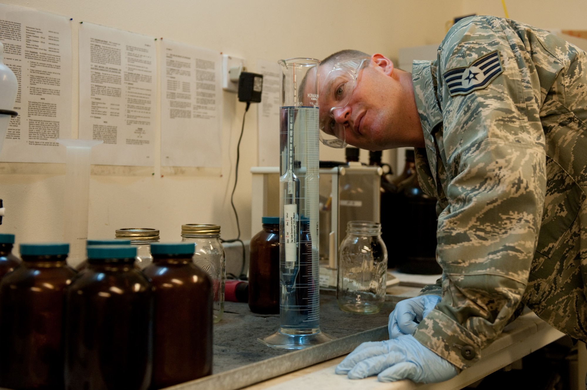 Staff Sgt. Michael Brady, 379th Expeditionary Logistics Readiness Squadron fuels laboratory NCOIC, performs an API gravity determination test on aviation gasoline, Oct. 14, 2009, in Southwest Asia. The fuels laboratory ensures all fuel received meets Air Force standards from reception to use by local aircraft or ground vehicles. Sergeant Brady is deployed from Dyess Air Force Base, Texas in support of operations Iraqi Freedom and Enduring Freedom. (U.S. Air Force photo/Staff Sgt. Robert Barney) 