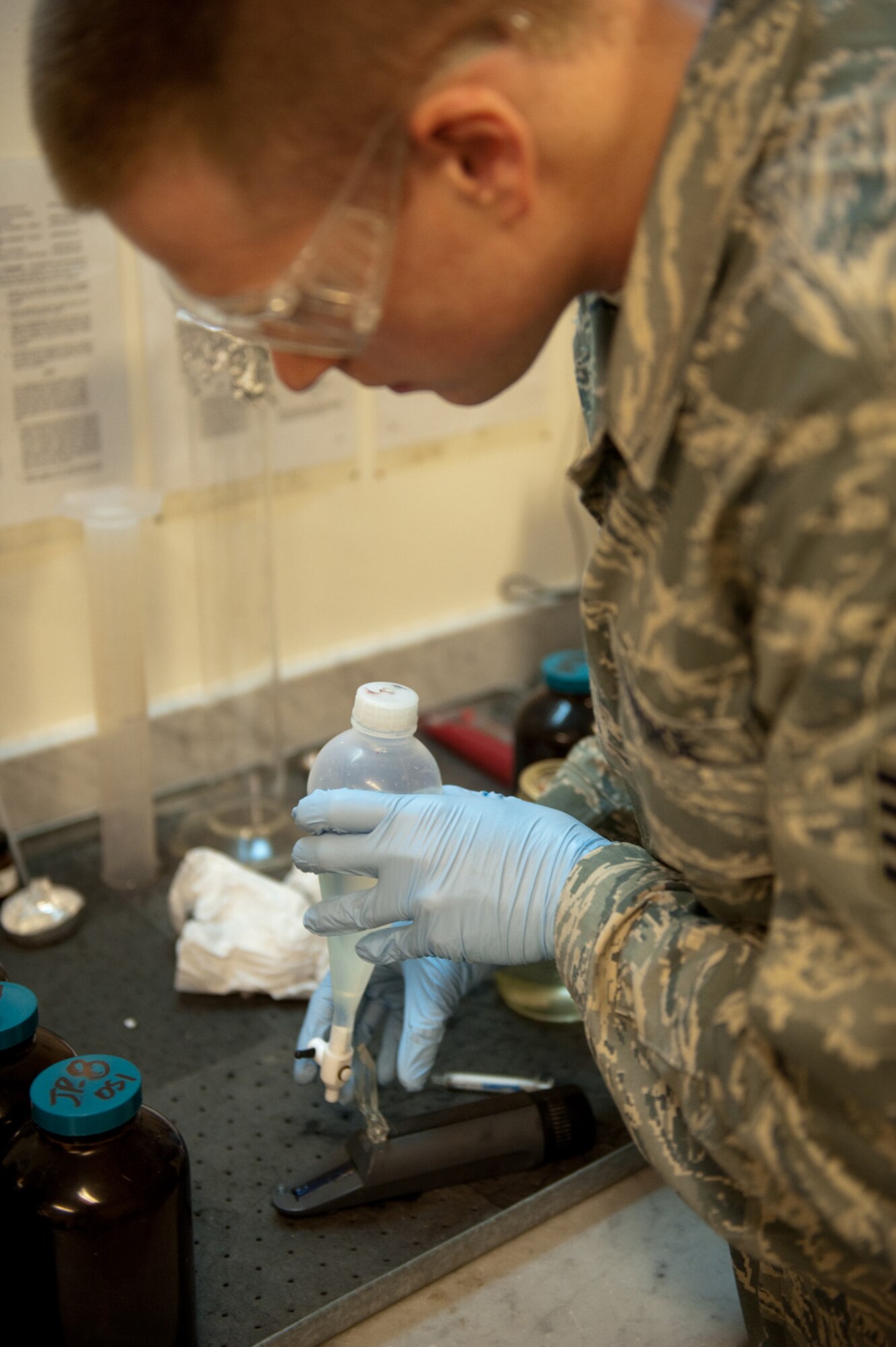 Staff Sgt. Damon Griffin, 379th Expeditionary Logistics Readiness Squadron fuels laboratory technician, tests a sample of JP-8 fuel, Oct. 14, 2009, in Southwest Asia. The fuels laboratory ensures all fuel received meets Air Force standards from reception to use by local aircraft or ground vehicles. Sergeant Griffin is deployed from Ramstein Air Base, Germany, in support of operations Iraqi Freedom and Enduring Freedom. (U.S. Air Force photo/Staff Sgt. Robert Barney) 