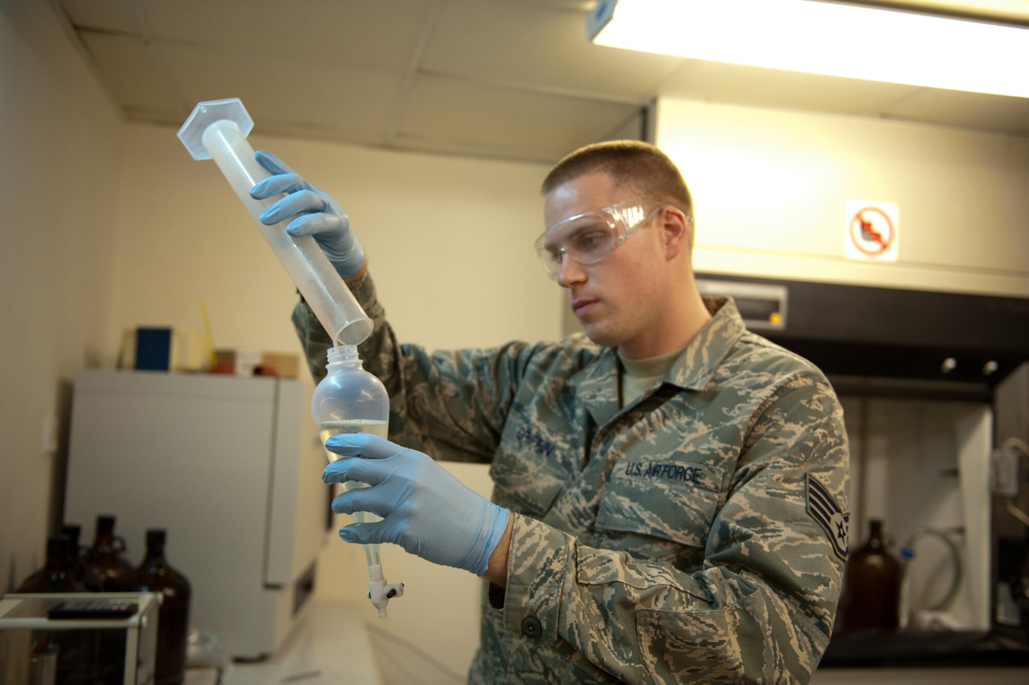 Staff Sgt. Damon Griffin, 379th Expeditionary Logistics Readiness Squadron fuels laboratory technician, tests a sample of JP-8 fuel, Oct. 14, 2009, in Southwest Asia. The fuels laboratory ensures all fuel received meets Air Force standards from reception to use by local aircraft or ground vehicles. Sergeant Griffin is deployed from Ramstein Air Base, Germany, in support of operations Iraqi Freedom and Enduring Freedom. (U.S. Air Force photo/Staff Sgt. Robert Barney) 