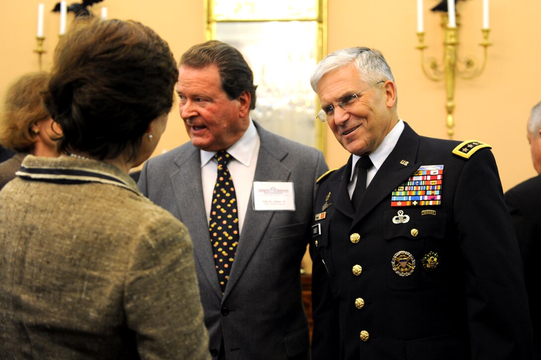 Chief of Staff of the Army Gen. George W. Casey, Jr. speaks with Katherine Winn, a family member of Gen. George C. Marshall, during the George C. Marshall Foundation Award presentation at the State Department in Washington, D.C., Oct. 16, 2009.  Defense Secretary of Defense Robert M. Gates received the award for a lifetime of distinguished service to his country and his focused, bipartisan leadership of two of the nation's most important institutions, the Defense Department and the Central Intelligence Agency.