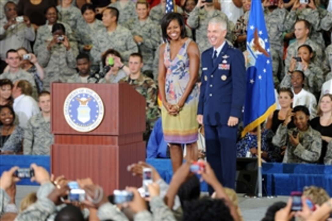 First Lady Michelle Obama and Maj. Gen. Charles R. Davis smile to the crowd before speaking on family values, Oct. 15, 2009, at Eglin Air Force Base, Fla. Davis is the commander of the Air Armament Center, Air Force Material Command at Eglin.