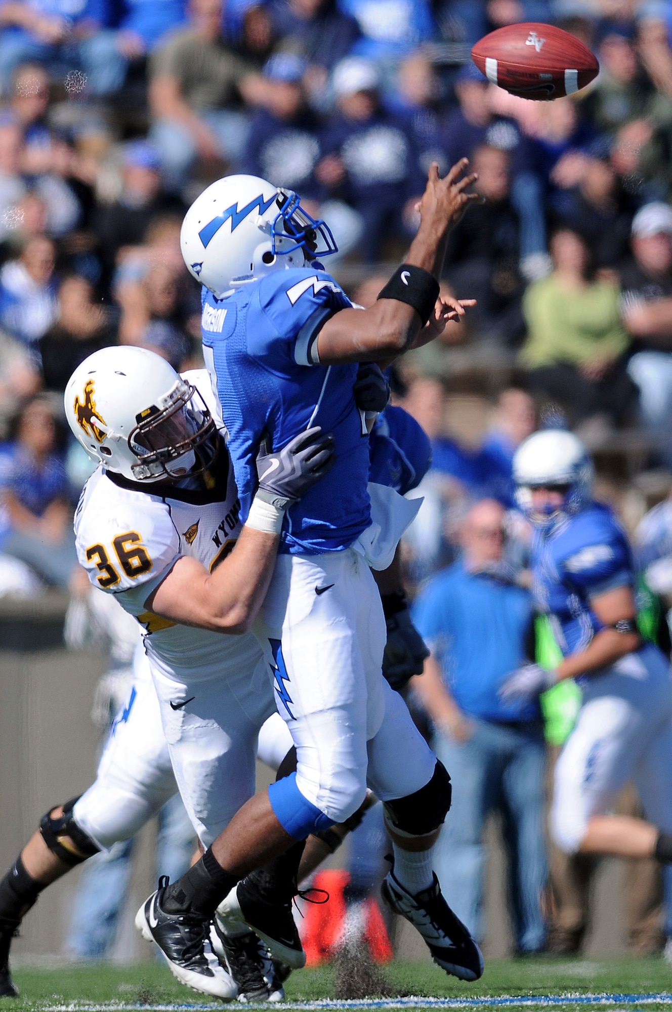 Sophomore quarterback Tim Jefferson fumbles after being hit by Wyoming senior outside linebacker Weston Johnson during the Air Force-Wyoming game at Falcon Stadium Oct 17, 2009. Jefferson, an Atlanta native, started for the Falcons but was replaced by sophomore QB Connor Dietz in the second half. Johnson is a native of Wray, Colo.  (U.S Air Force photo/Rachel Boettcher)