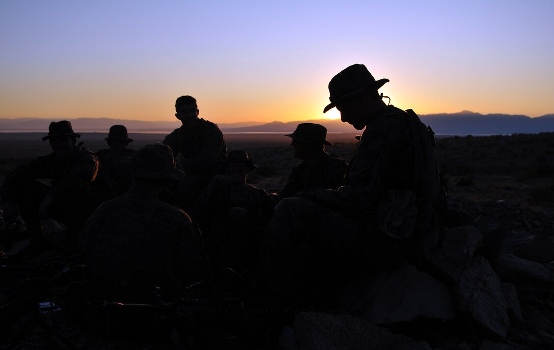 Company A, 1st Battalion, 2nd Marine Regiment, Marines spend some down time relaxing after battle sight zeroing their weapons at the Camp Billy Machen desert warfare training facility in the Chocolate Mountain Aerial Gunnery Range in California Oct. 17, 2009. The Camp Lejeune, N.C.-based company spent three days at the camp, making use of its rocky, mountainous terrain to prepare for an upcoming deployment to Afghanistan early next year. While at the camp, the Marines carried out fire team live-fire ambush and reaction drills as well as squad-sized combat patrols.