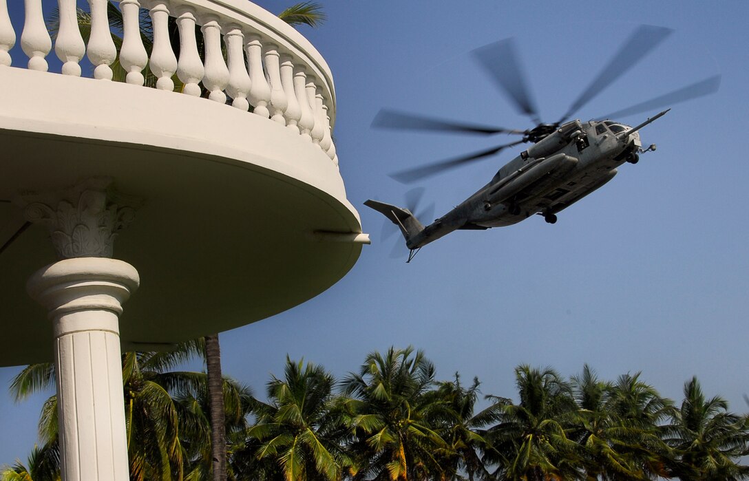 A U.S. Marine Corps helicopter approaches a landing zone at the American embassy here Oct. 18. The helicopter was a CH-53E Super Stallion flown by members of Marine Medium Helicopter Squadron 166 (Reinforced), which is the aviation combat element of the 11th Marine Expeditionary Unit.
