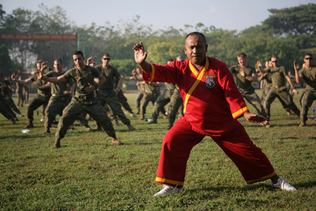 An Indonesian martial arts instructor teaches fighting movements to Marines with Company G, Battalion Landing Team 2/4, here Oct. 17. The Marines, deployed with the 11th Marine Expeditionary Unit, learned jungle survival skills from the Indonesians Oct. 16-23.