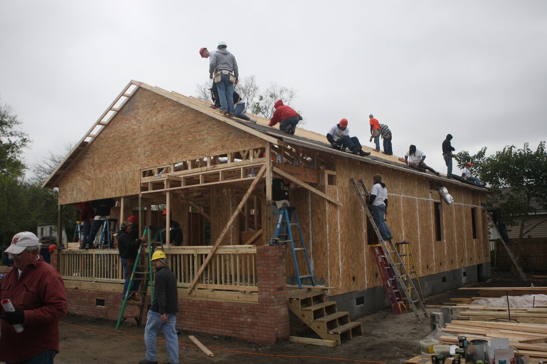 (NEW BERN, N.C.) Military and civilian volunteers from across New Bern, N.C. came together for the first Blitz Build event put on by Habitat for Humanity, Oct. 17 and 18. The build, which constructs houses for underprivileged families, completes the exterior of the houses while the interior and furnishings are completed throughout the week. (Marine Corps photo by Lance Cpl. Jonathan G. Wright)