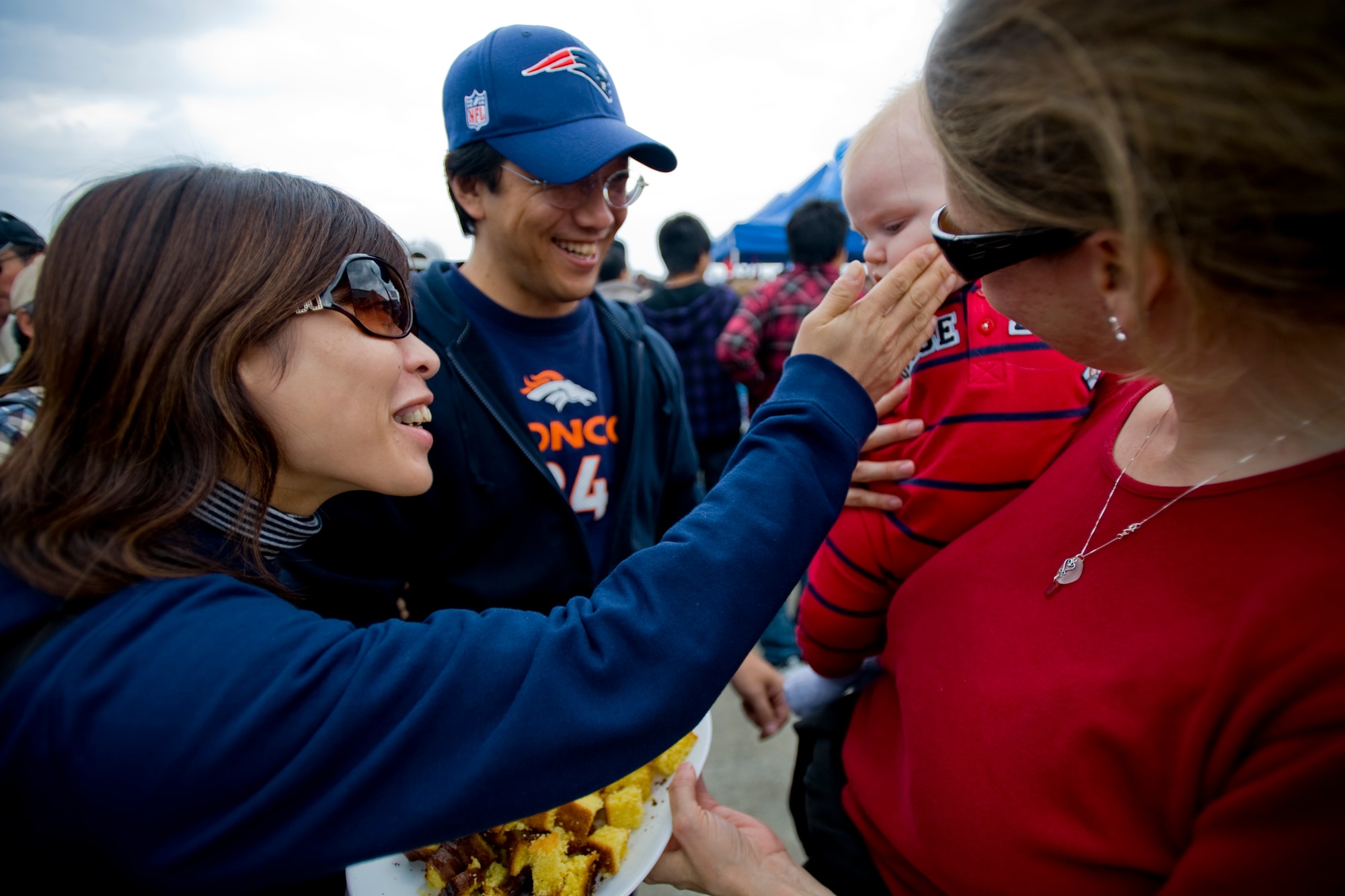 MISAWA AIR BASE, Japan -- Tami and Cameron Hales attract guests while passing out cake samples during the Misawa Air Fest 2009 Oct. 18. (U.S. Air Force photo/Senior Airman Jamal D. Sutter)