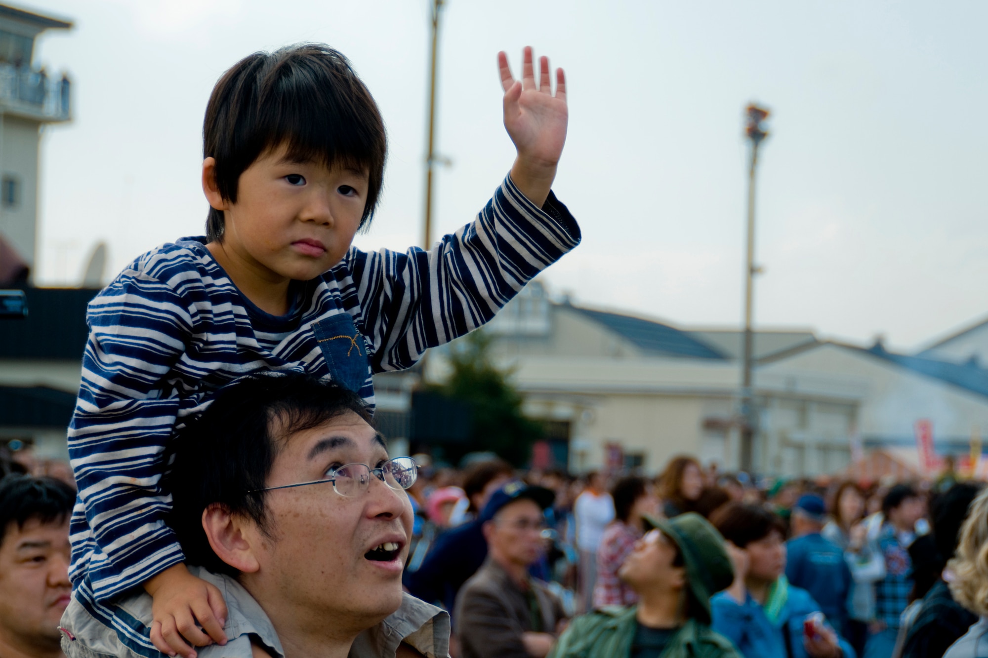 MISAWA AIR BASE, Japan -- A young boy waves to taxiing aircraft during the Misawa Air Fest 2009 Oct. 18. (U.S. Air Force photo/Senior Airman Jamal D. Sutter)