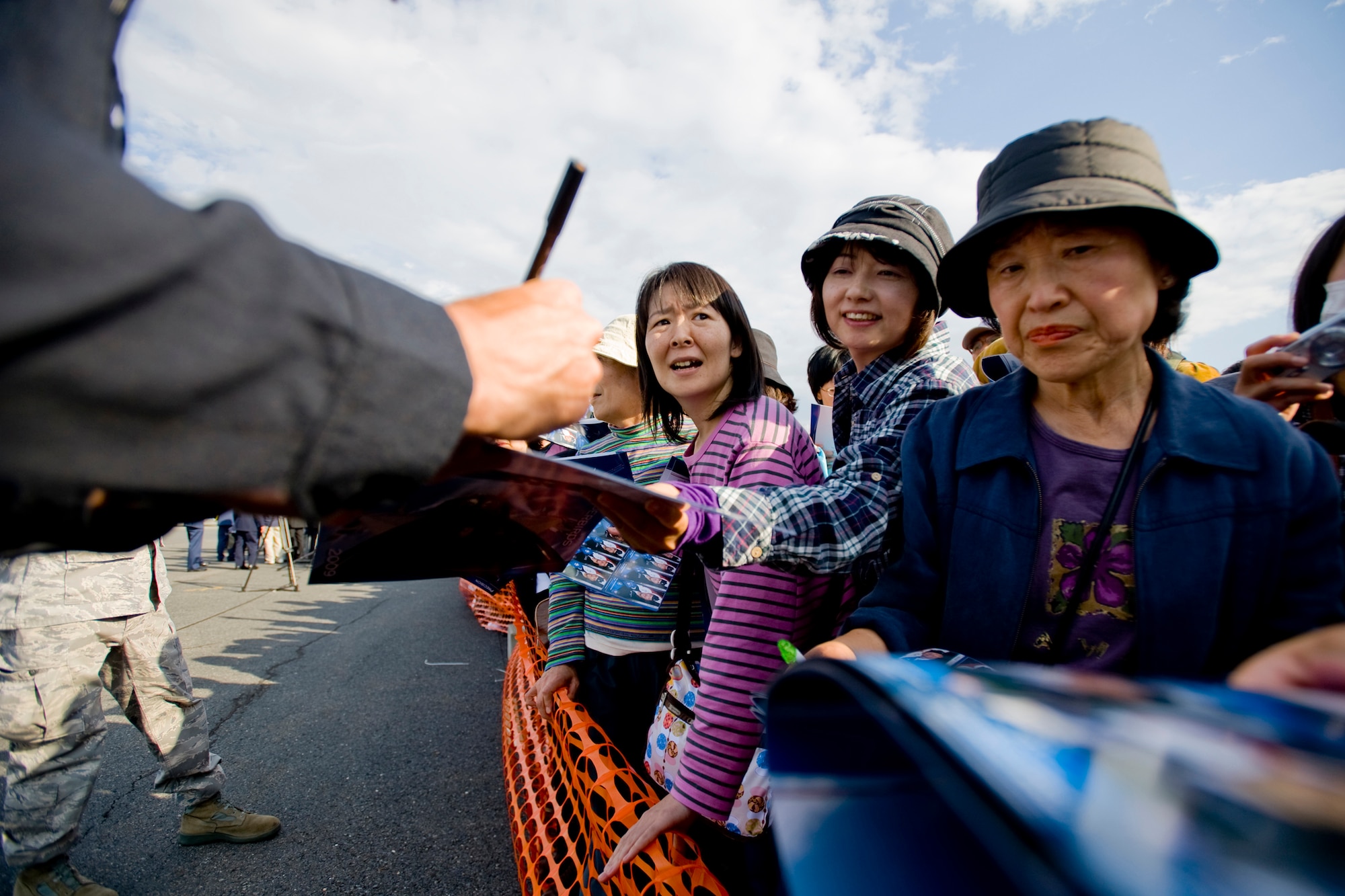 MISAWA AIR BASE, Japan -- Base guests receive autographs from a U.S. Air Force Thunderbirds pilot during the Misawa Air Fest 2009 Oct. 18. (U.S. Air Force photo/Senior Airman Jamal D. Sutter)