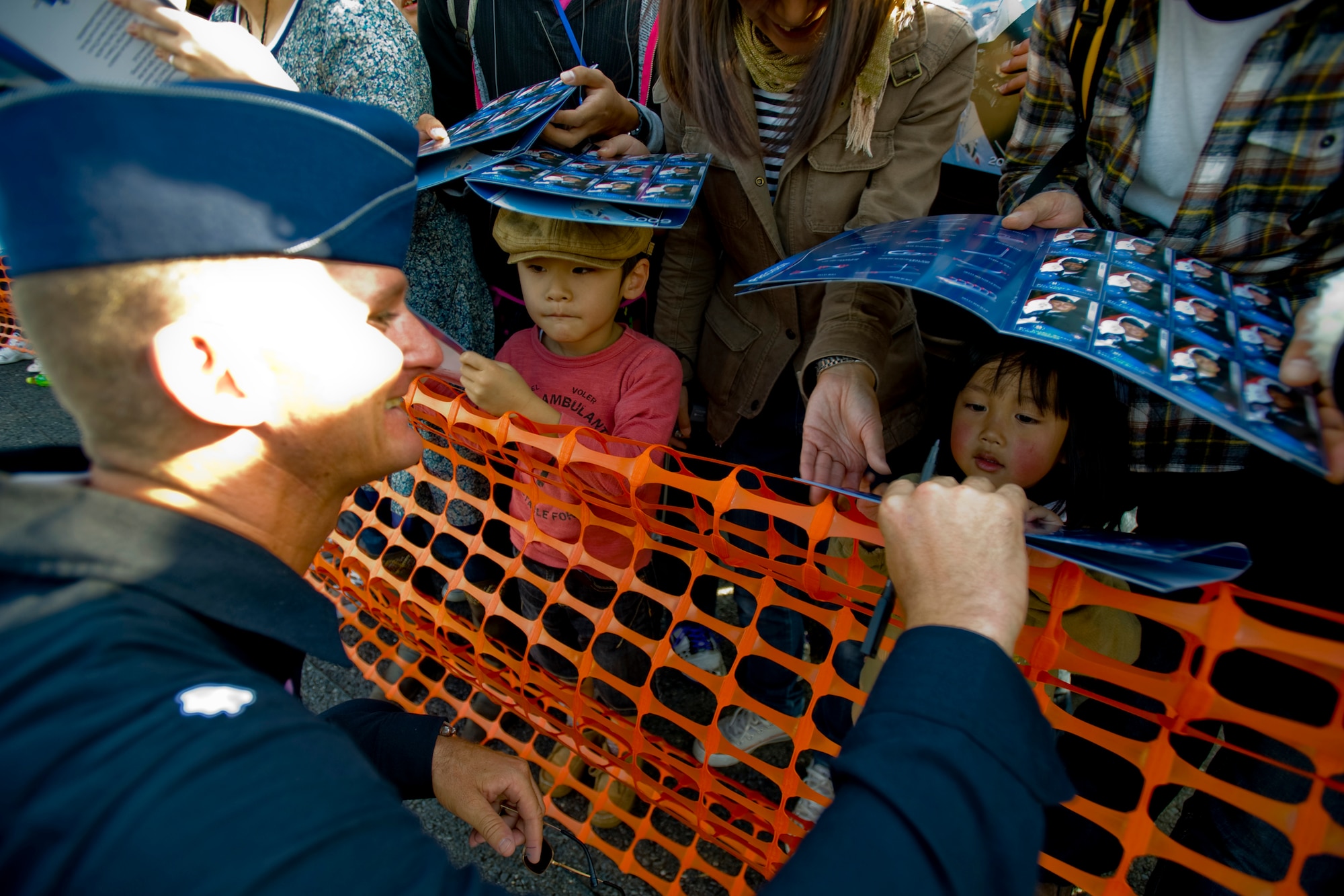 MISAWA AIR BASE, Japan -- Lt. Col. Derek Routt, operations officer and pilot for the U.S. Air Force Thunderbirds demonstration team, signs autographs during the Misawa Air Fest 2009 Oct. 18. (U.S. Air Force photo/Senior Airman Jamal D. Sutter)