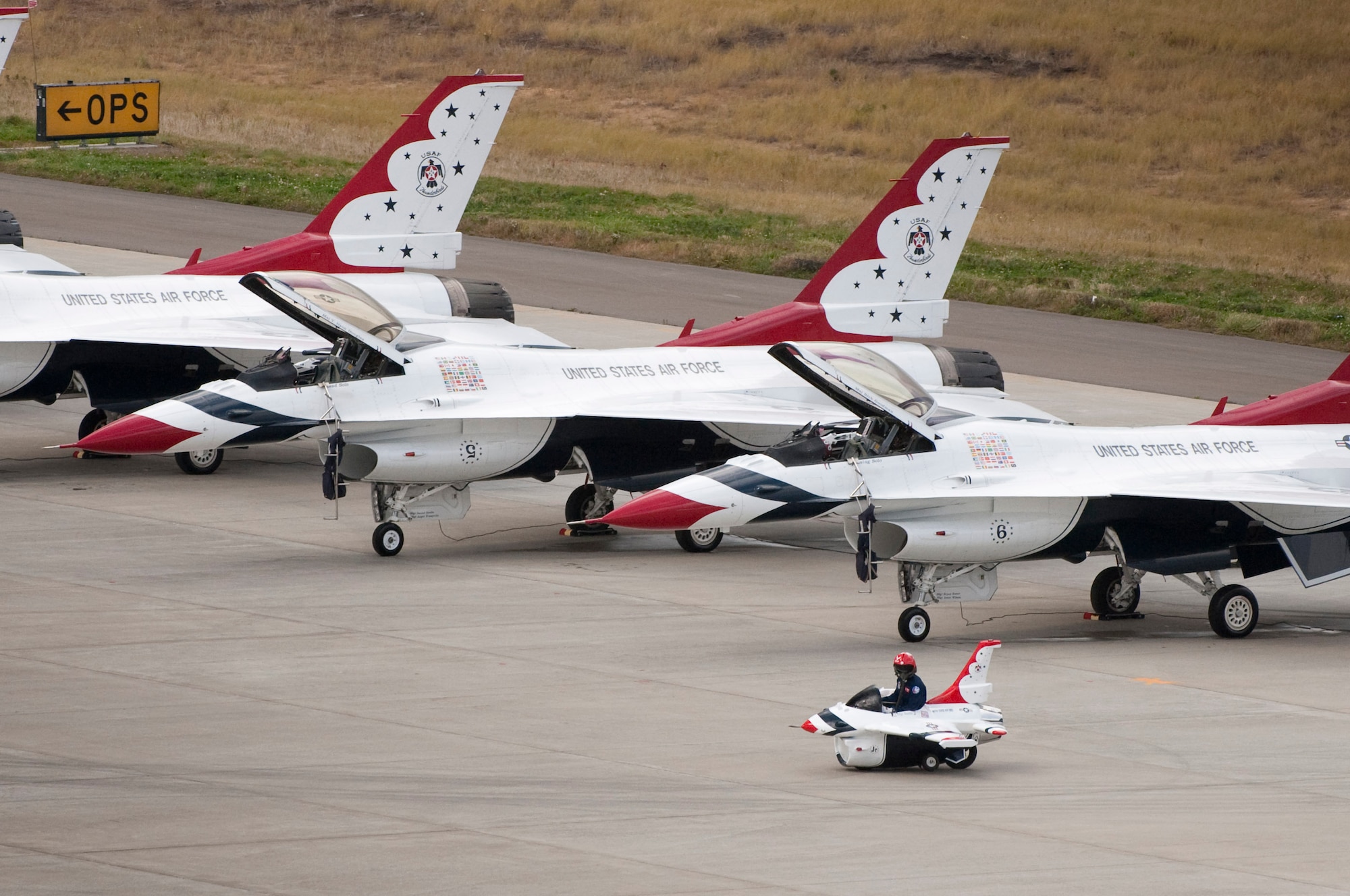 MISAWA AIR BASE, Japan -- A Thunderbird Junior speeds past its larger counterparts during Air Fest 2009 Oct. 18. (U.S. Air Force photo/Staff Sgt. Samuel Morse)