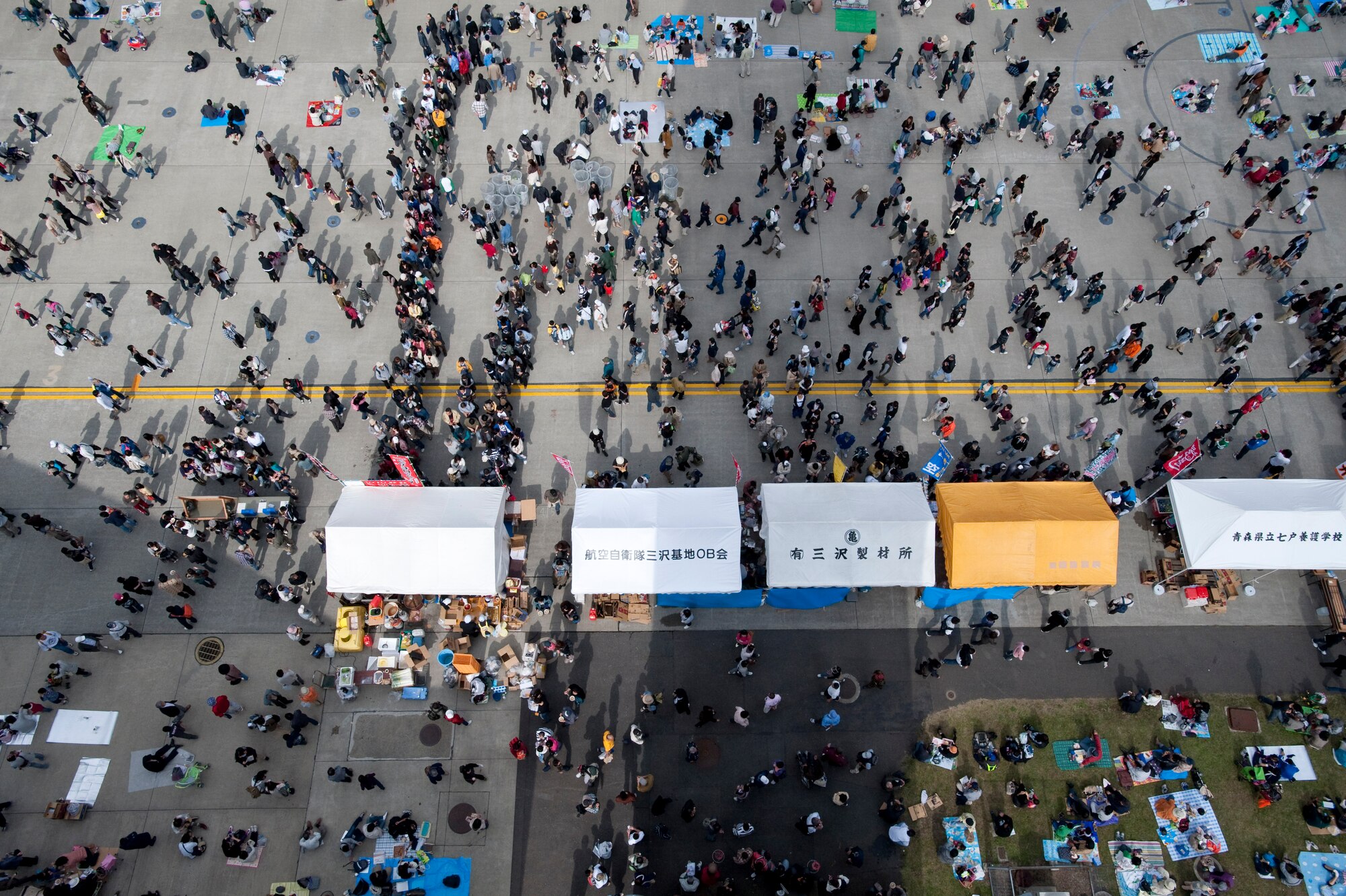 MISAWA AIR BASE, Japan -- Spectators line up for yakisoba and other food items for lunch during Air Fest 2009 Oct. 18. American and Japanese food vendors offered a wide selection of multi-cultural food for the attendees. (U.S. Air Force photo/Staff Sgt. Samuel Morse)