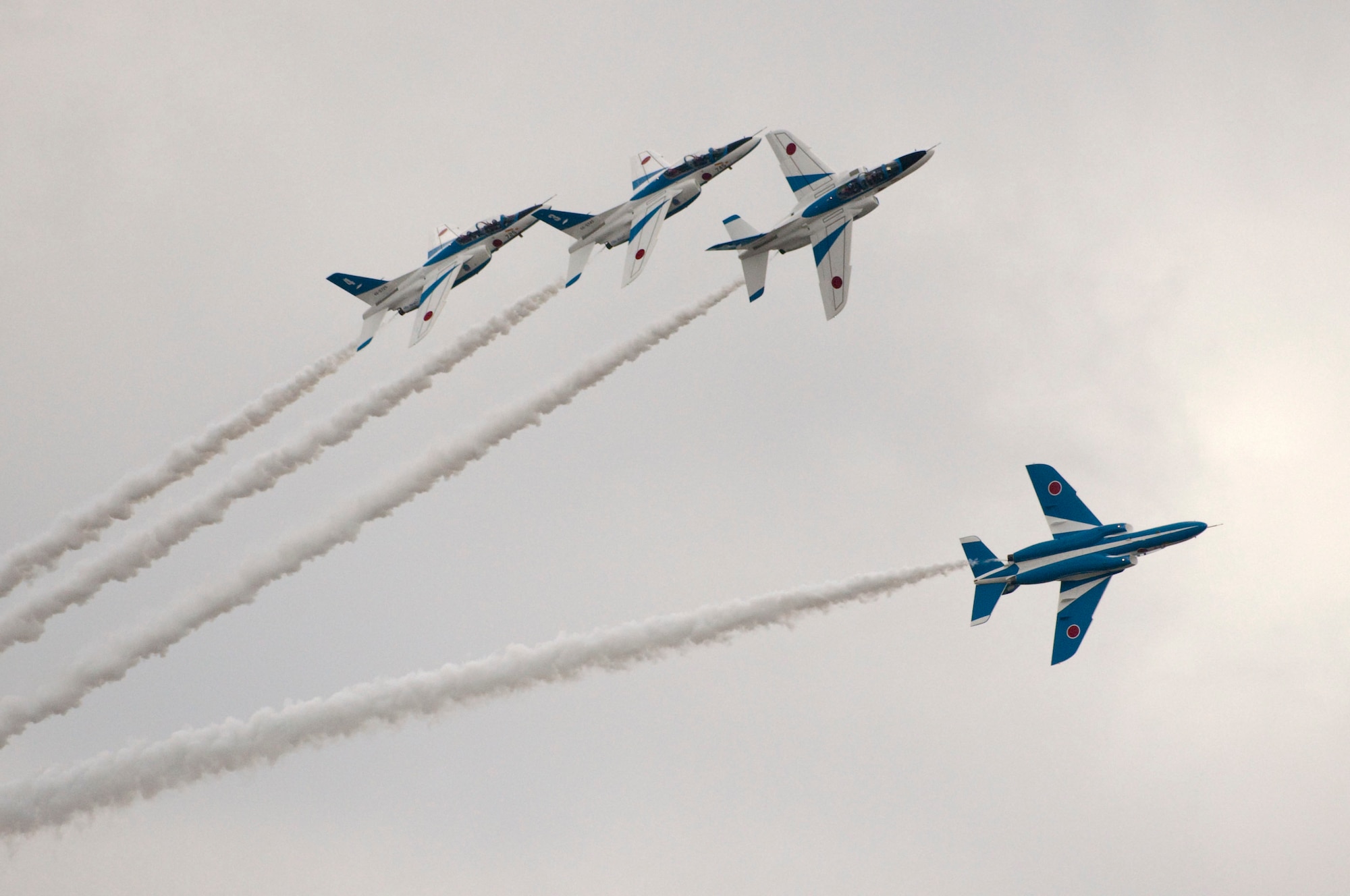 MISAWA AIR BASE, Japan -- Japanese demonstration team Blue Impulse breaks formation during Air Fest 2009 Oct. 18. (U.S. Air Force photo/Staff Sgt. Samuel Morse)