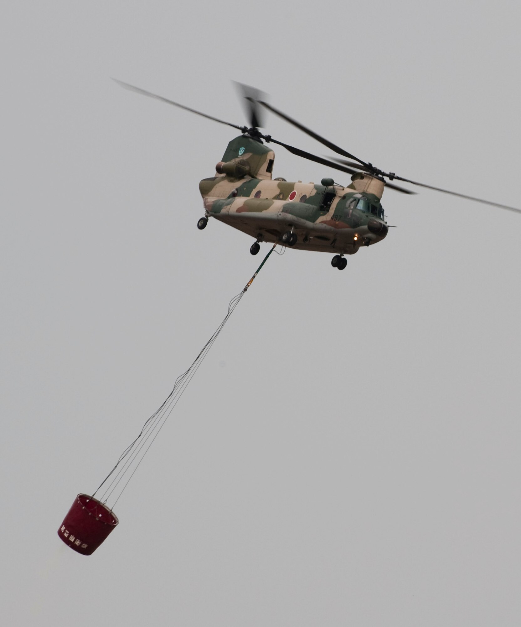MISAWA AIR BASE, Japan -- A Japanese MH-53 helicopter demonstrates its firefighting capabilities during Air Fest 2009 Oct. 18. (U.S. Air Force photo/Staff Sgt. Samuel Morse)