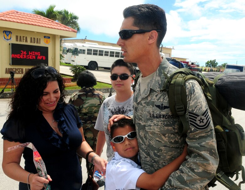 ANDERSEN AFB, GUAM - HARRT TEAM members reunite with their families, Oct. 18 here. The HARRT Team, consisting of 70 personnel members, deployed to Indonesia on Oct. 5 and treated over 1,900 patients before returning. (U.S. Air Force photo by Airman 1st Class Julian North)
