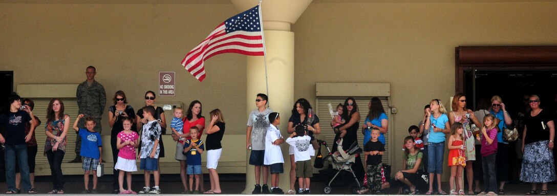 ANDERSEN AFB, GUAM - The families of members of the HARRT Team await their return from their first deployment, Oct. 18 here . The HARRT Team, consisting of 70 personnel members, deployed to Indonesia on Oct. 5 and treated over 1,900 patients before returning. (U.S. Air Force photo by Airman 1st Class Julian North)