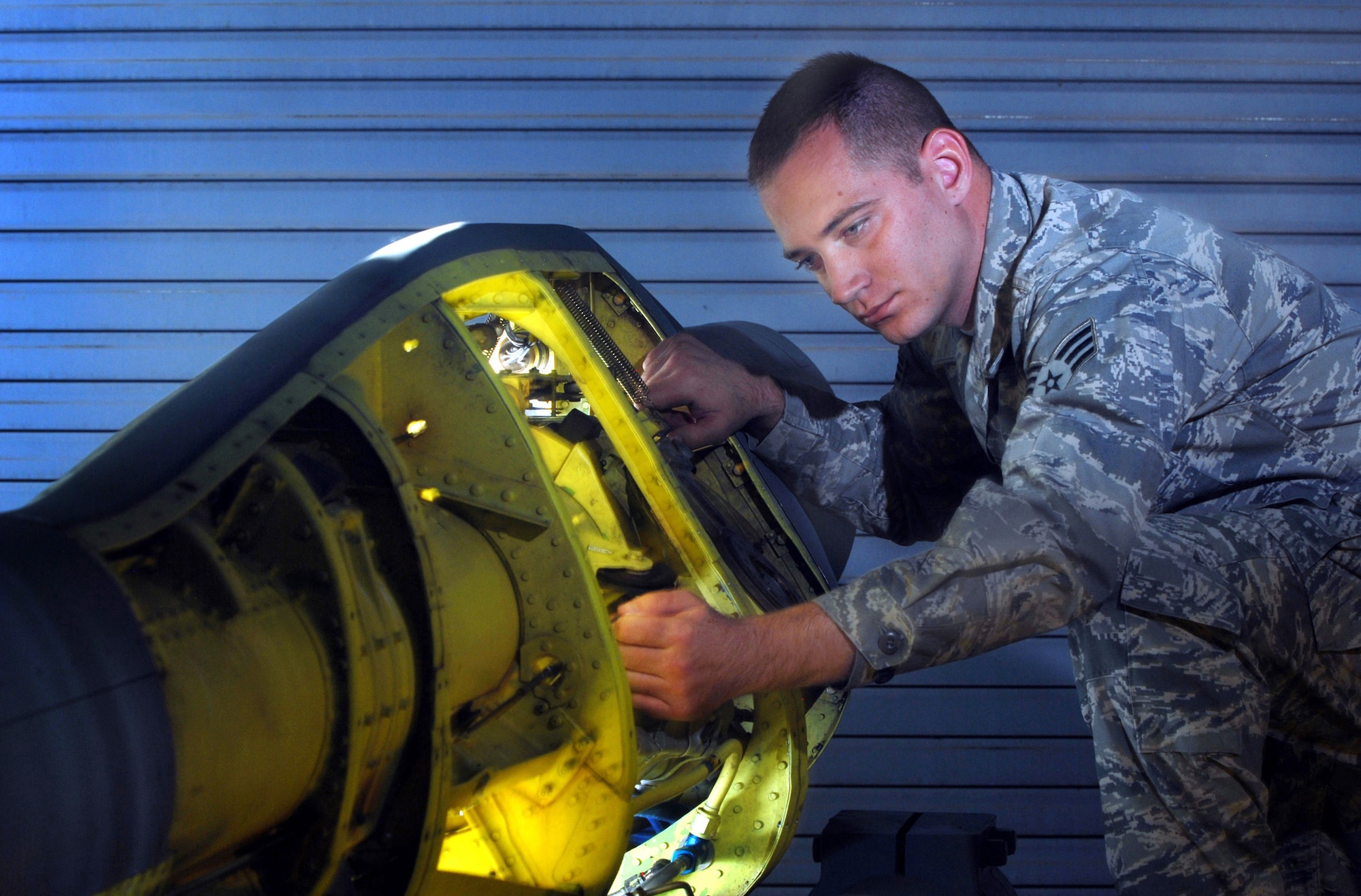 Senior Airman Jack Sellers checks the refueling boom assembly of a KC-135 Stratotanker aircraft during mid-cycle inspection at March ARB, Oct. 5. The Airmen are part of the 452nd Maintenance Squadron’s aircraft pneudraulics systems shop. (U.S. Air Force Photos by Val Gempis)