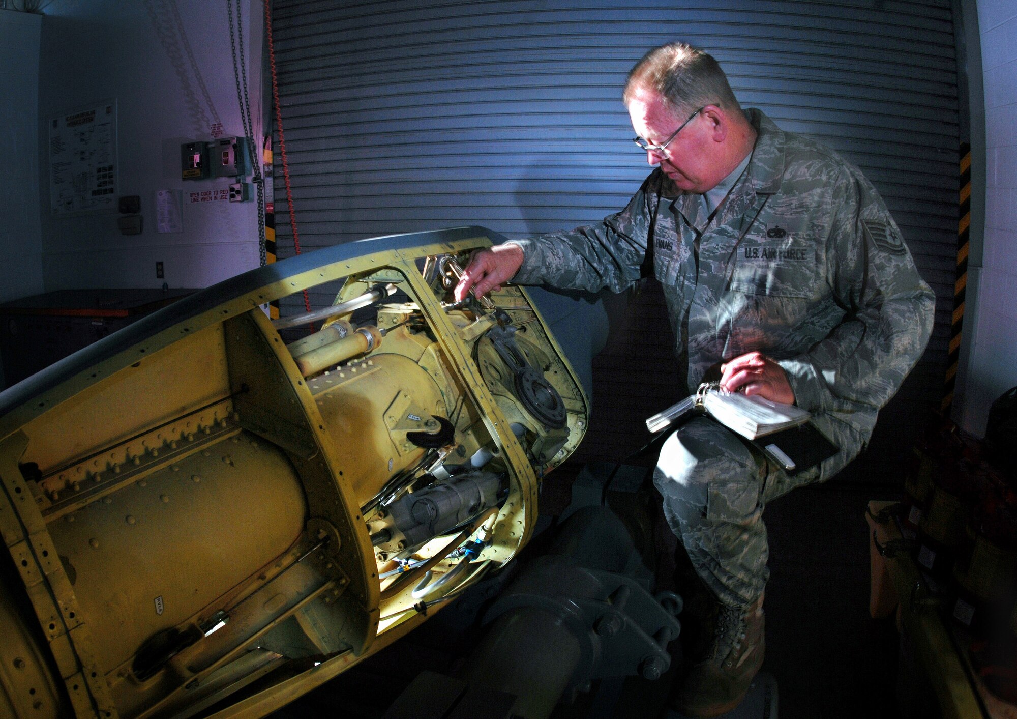 Tech. Sgt. Gary Evans checks the refueling boom assembly of a KC-135 Stratotanker aircraft during mid-cycle inspection at March ARB, Oct. 5. The Airmen are part of the 452nd Maintenance Squadron’s aircraft pneudraulics systems shop. (U.S. Air Force Photos by Val Gempis)
