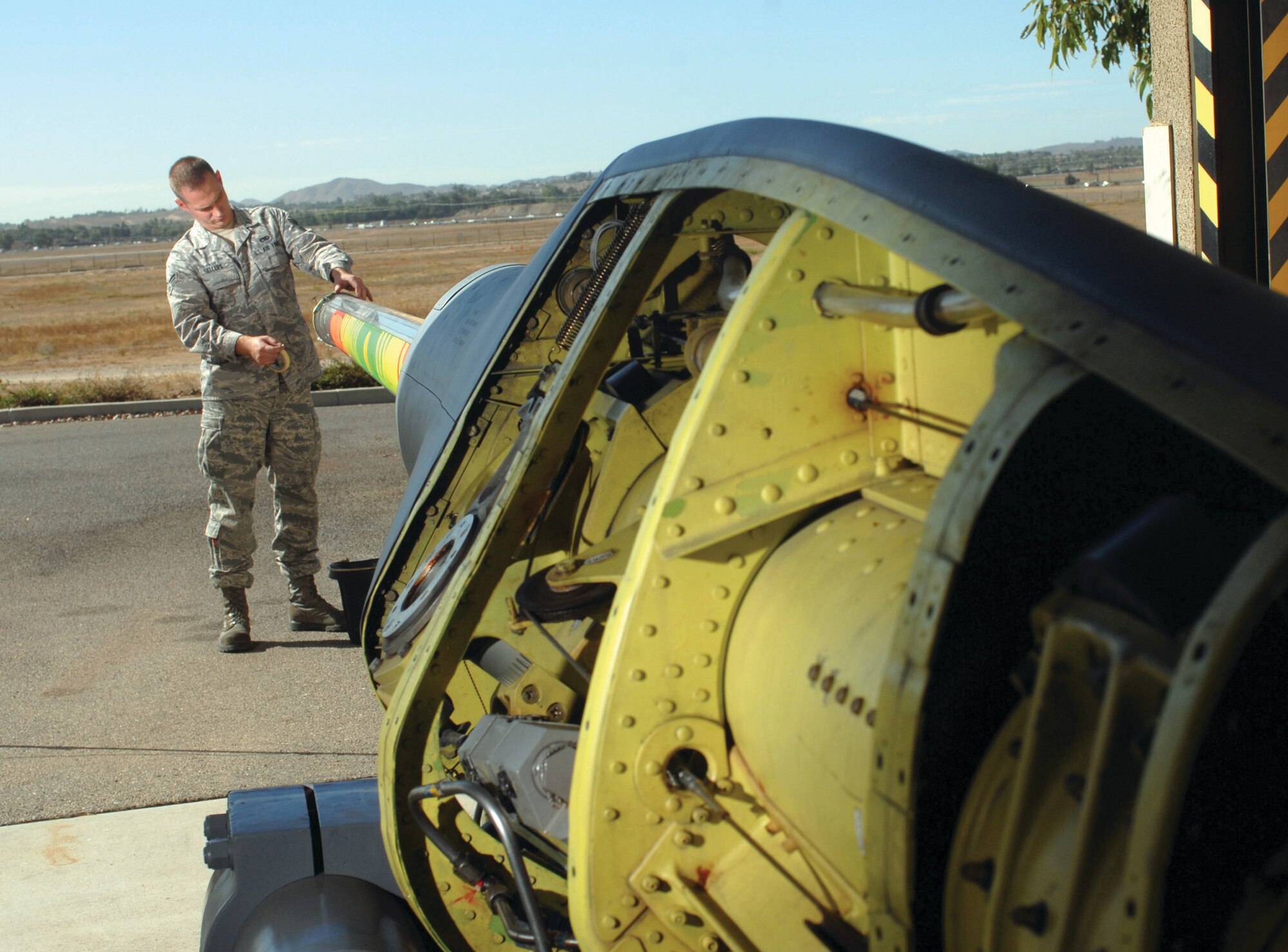 Senior Airman Jack Sellers checks the receptacle of the refueling boom assembly of a KC-135 Stratotanker aircraft during mid-cycle inspection at March Air ARB, Oct. 5. Airman Sellers is a member of the 452nd Maintenance Squadron’s aircraft pneudraulics systems shop. (U.S. Air Force Photos by Val Gempis)
