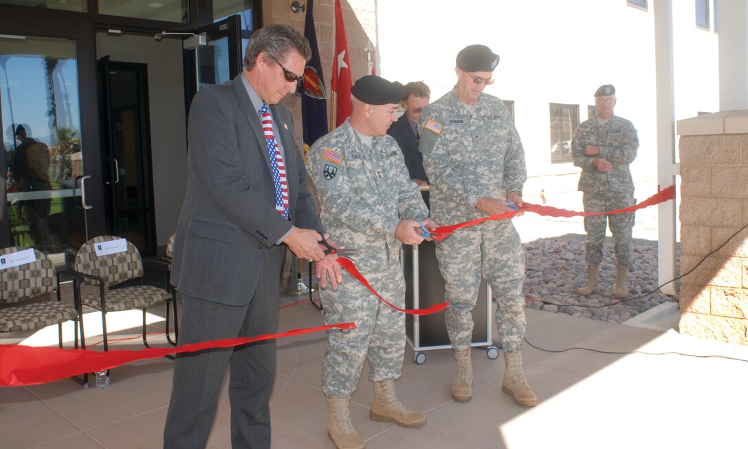 Army Reserve Maj. Gen. Bruce Casella, Brig. General Scott Johnson, and City of Perris Mayor Pro Tem Mark Yarbruogh cut the ribbon to mark the opening of the Army Reserve’s March Armed Forces Reserve Center Oct. 3. The four buildings in the new center total over 132,000 square feet and cost $30 million to complete. (U.S. Air Force photo by Tech. Sgt. Joe Davidson)
