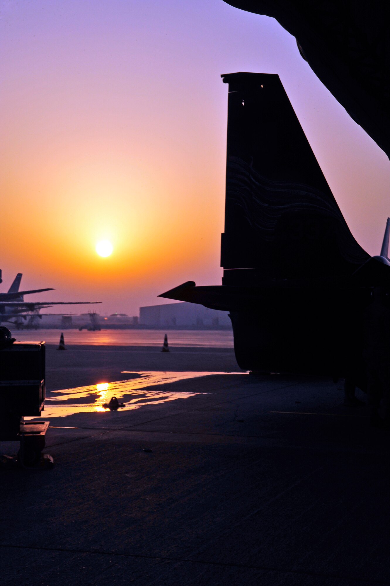 SOUTHWEST ASIA—The tail of U-2 Dragon Lady No. 068-0337 is silhouetted in the dawn of Oct. 18, 2009, prior to its mission that would exceed her 25,000th hour of flight. The plane was piloted by Lt. Col. Robert B. Wehner, 380th Expeditionary Reconnaissance Squadron. (U.S. Air Force Photo by 2nd Lt. Kidron B. Vestal)