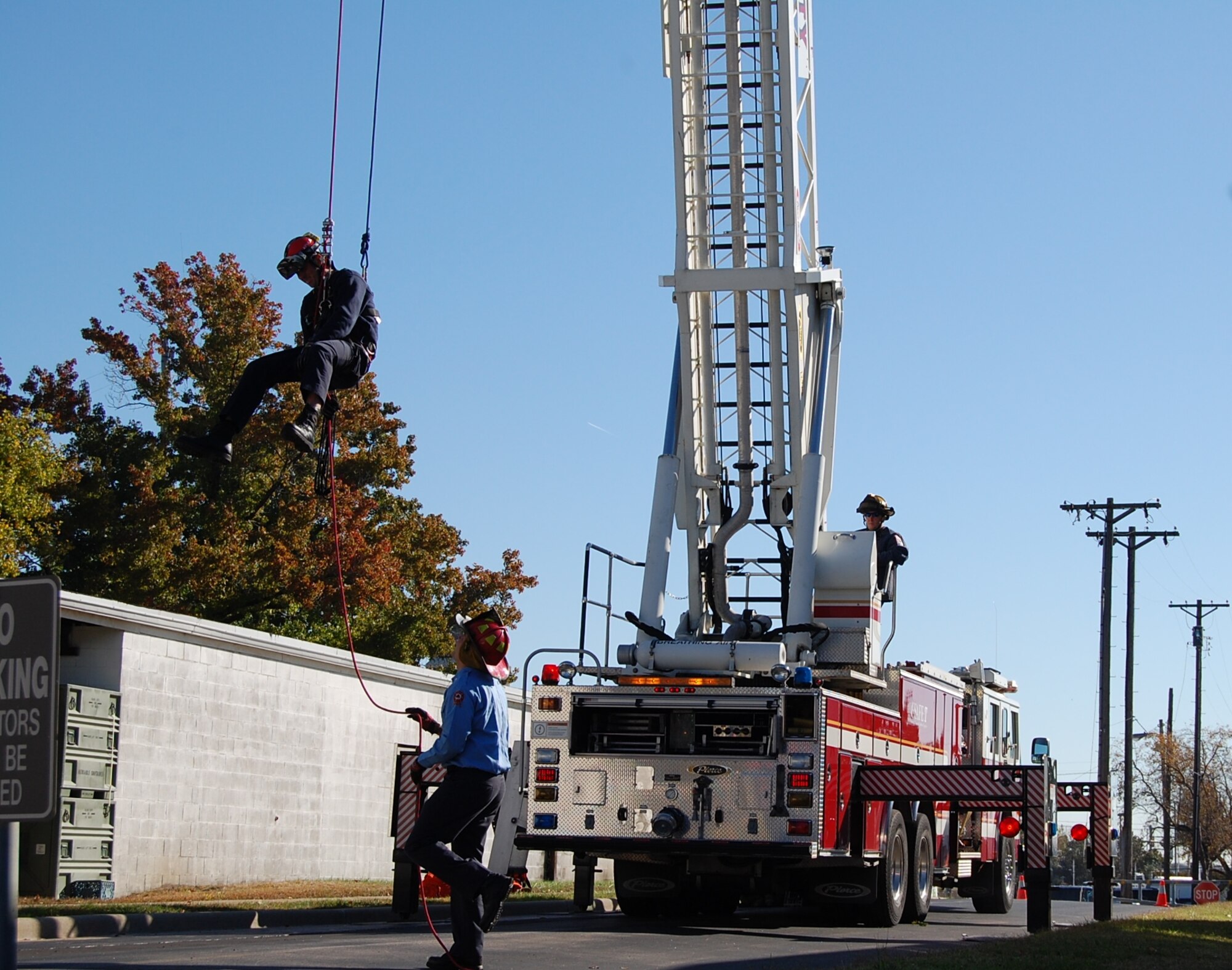 Senior Master Sgt. David Maupin, 231st Civil Engineer Flight, rappels down a line during a rappel demonstration done for servicemembers at Lambert International Airport Oct. 18 in honor of Fire Safety Month to show the members some of the local firefighters training. (Photo by Senior Airman Jessica Donnelly)