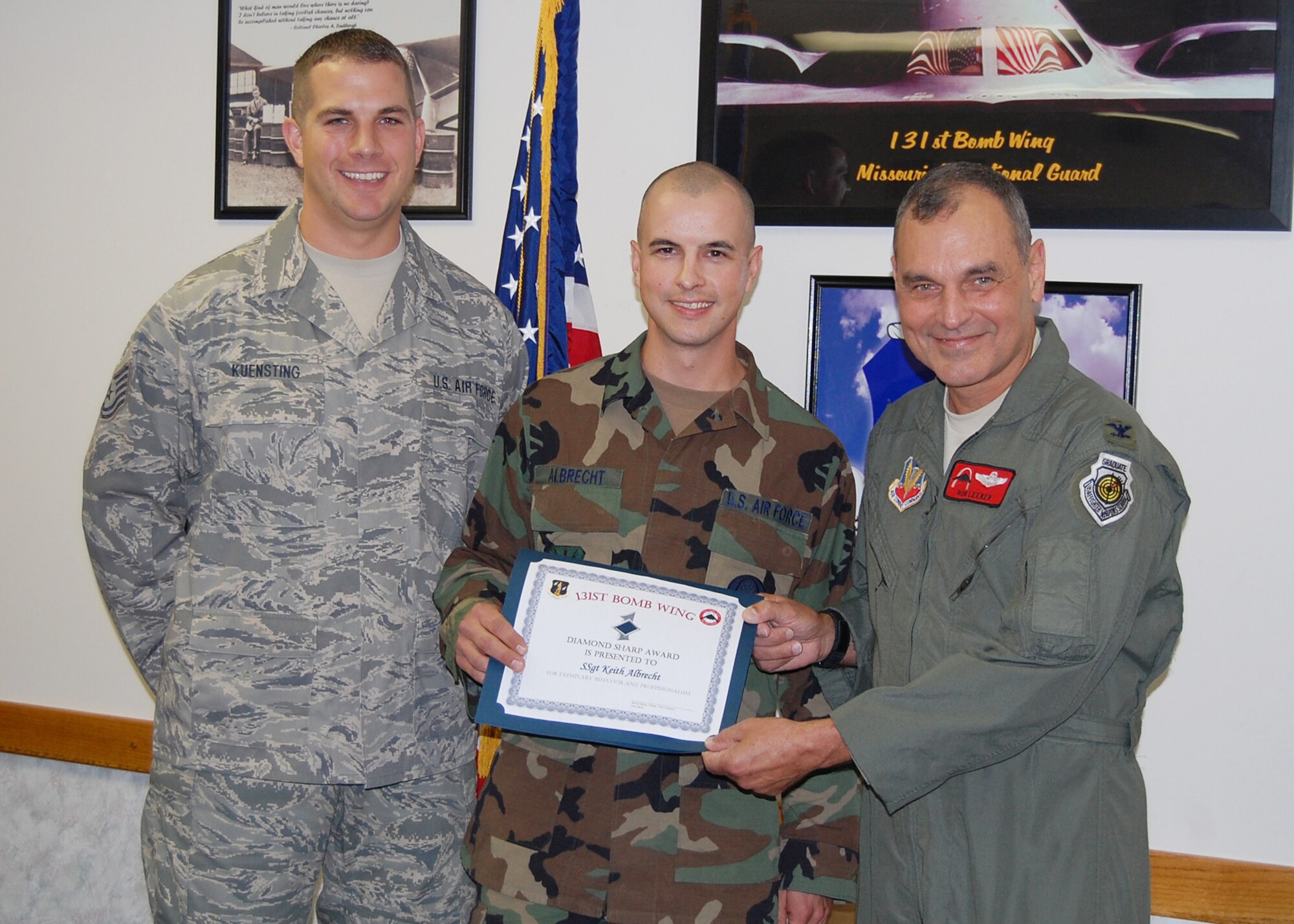 Staff Sgt. Keith S. Albrecht, 239th Combat Communications Squadron voice network systems, was awarded the Diamond Sharp Award October UTA for exemplary service to the Squadron by Tech Sgt. Matthew Kuensting, 239th CBCS acting 1st Sergeant.  The Diamond Sharp Award is an award given by 1st Sergeant's to honor Airmen for their outstanding overall performance. (Photo by Master Sgt. Mary-Dale Amison)