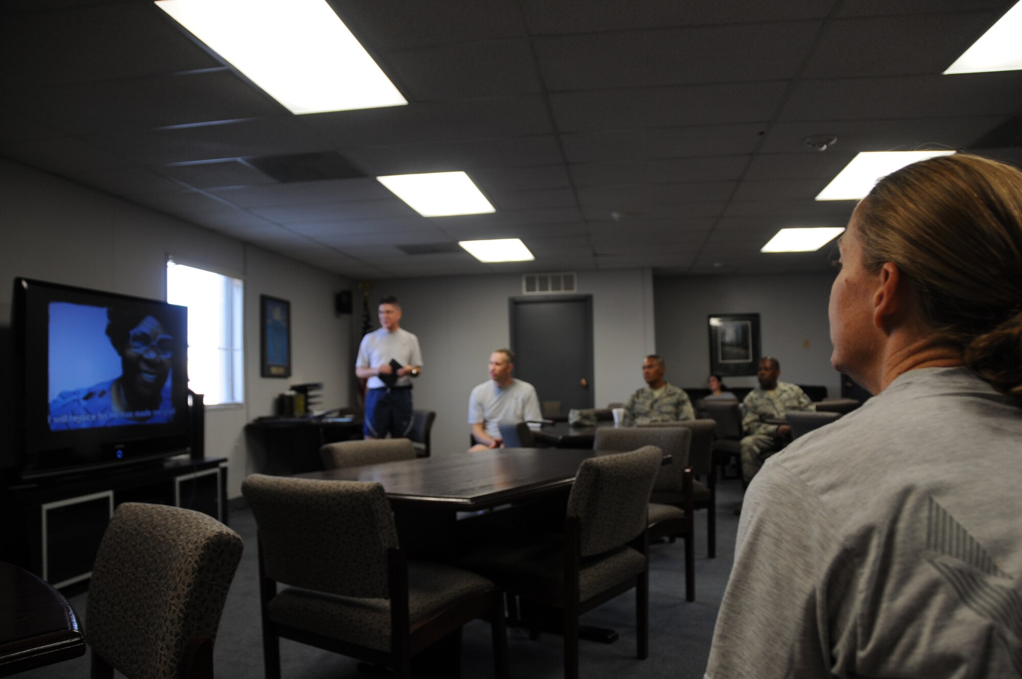 944th Fighter Wing members listen to praise songs during the October UTA worship service. A Christian service is held in building 999A each Sunday morning starting at 8 a.m.  Everyone is encouraged to stop by during the November UTA for worship, fellowship and to meet the new Chaplain, Captain Lawrence Kittle who joined the wing in September. (U.S. Air Force photo/Tech. Sgt. Barbara Plante) 