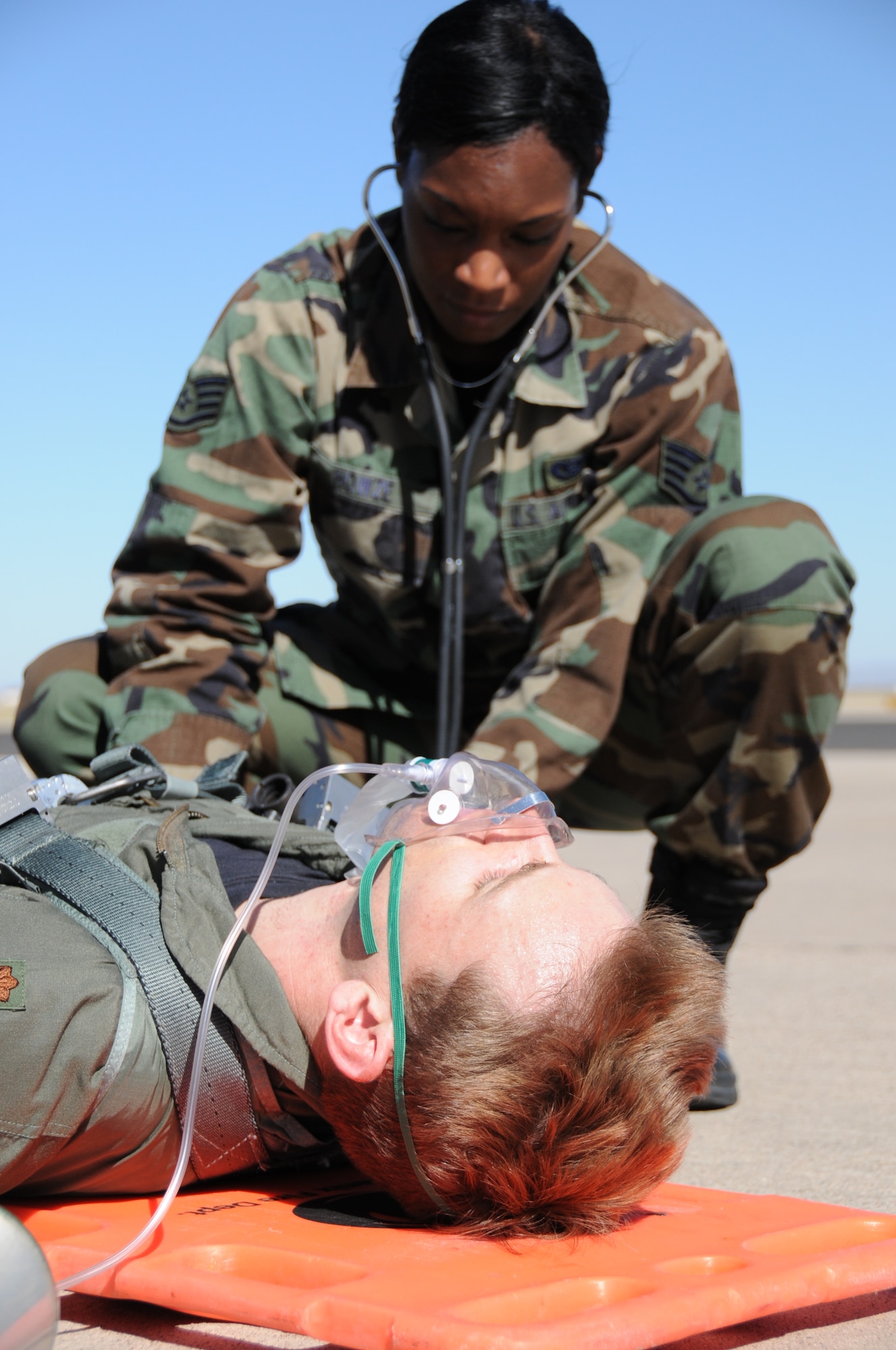 Staff Sgt. Nikela Howze, 944th Civil Engineer Squadron firefighter, performs a medical evaluation during an egress exercise Oct. 17. The 944th CES, along with the rest of the 944th Fighter Wing, underwent a Staff Assistance Visit Oct. 12 through 19 in preparation for the wing's upcoming Unit Compliance Inspection. (U.S. Air Force photo/Tech. Sgt. Susan Stout)