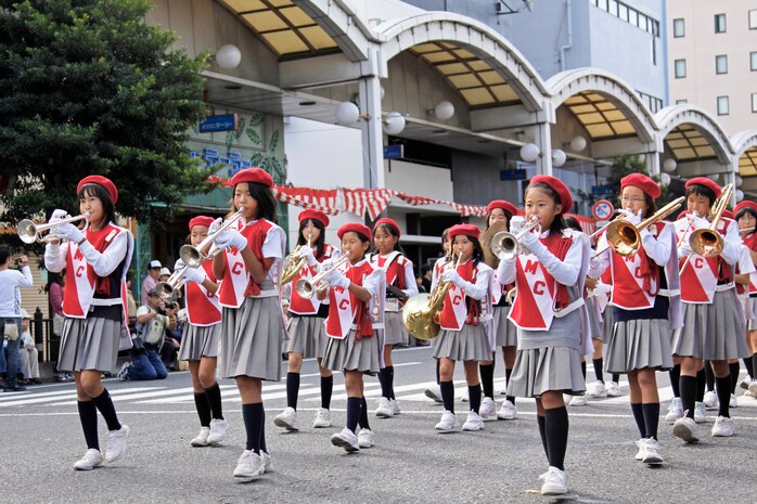 A local school band parades down the streets of Iwakuni during the 53rd Annual Iwakuni Festival Sunday. In addition to the parade, various stands selling food, clothing and trinkets were set up for festival goers.
