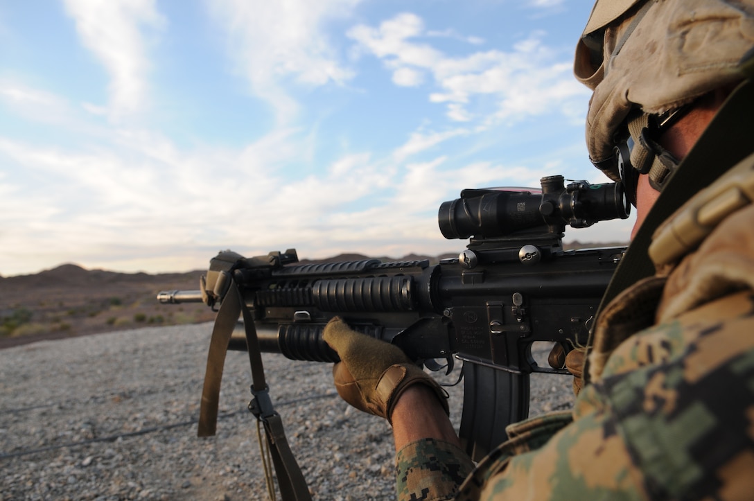 Cpl. Brandon Legendre, a police sergeant with Headquarters and Service Company, 1st Battalion, 2nd Marine Regiment, sights in to fire on a target during infantry tactics training at Graze Range at the U.S. Army Yuma Proving Ground in Arizona, Oct. 18, 2009. Comprised of Marines with noninfantry specialties, the Camp Lejeune, N.C.-based company is preparing to operate as an infantry company during their upcoming deployment to Afghanistan in the spring of 2010.