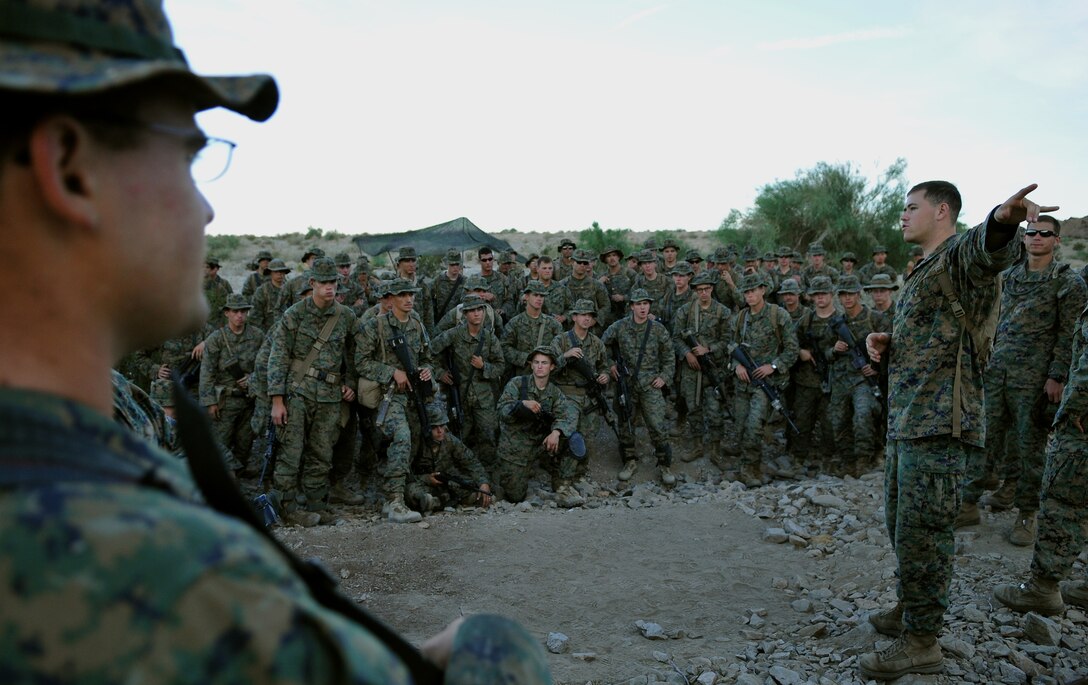 1st Lt. Craig Bryan, executive officer of Company A, 1st Battalion, 2nd Marine Regiment, briefs his Marines on the plan of the day at the Camp Billy Machen desert warfare training facility in the Chocolate Mountain Aerial Gunnery Range in California Oct. 18, 2009. The Camp Lejeune, N.C.-based company spent the day running team live-fire ambush and reaction drills in conjunction with a series of classes, on topics ranging from call for fire to heavy machine guns. Company A spent three days at the camp, making use of its rocky, mountainous terrain to prepare for an upcoming deployment to Afghanistan early next year. Bryan, 25, is a native of Monte Vista, Colo.