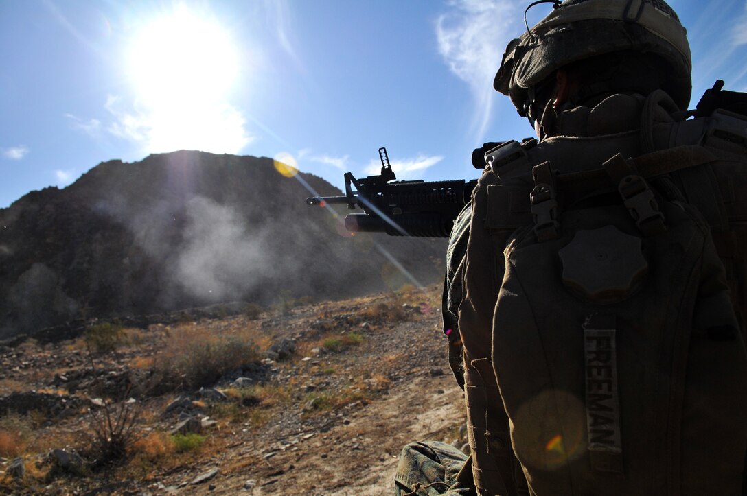 Lance Cpl. Jace Freeman, a fire team leader with Company A, 1st Battalion, 2nd Marine Regiment, fires his M-203 grenade launcher during a live-fire ambush and reaction drill at the Camp Billy Machen desert warfare training facility in the Chocolate Mountain Aerial Gunnery Range in California Oct. 18, 2009. The Camp Lejeune, N.C.-based company spent three days in California, making use of the camp’s rocky, mountainous terrain to prepare for an upcoming deployment to Afghanistan early next year. “As much as I hate this terrain, I’m glad we’re training on it,” said Freeman, 21, from Cedar Rapids, Iowa. “It’s difficult to maneuver on, but as we move through, it’s forcing us to work even more as a team, and it gives us an idea of what’s to come in Afghanistan.”