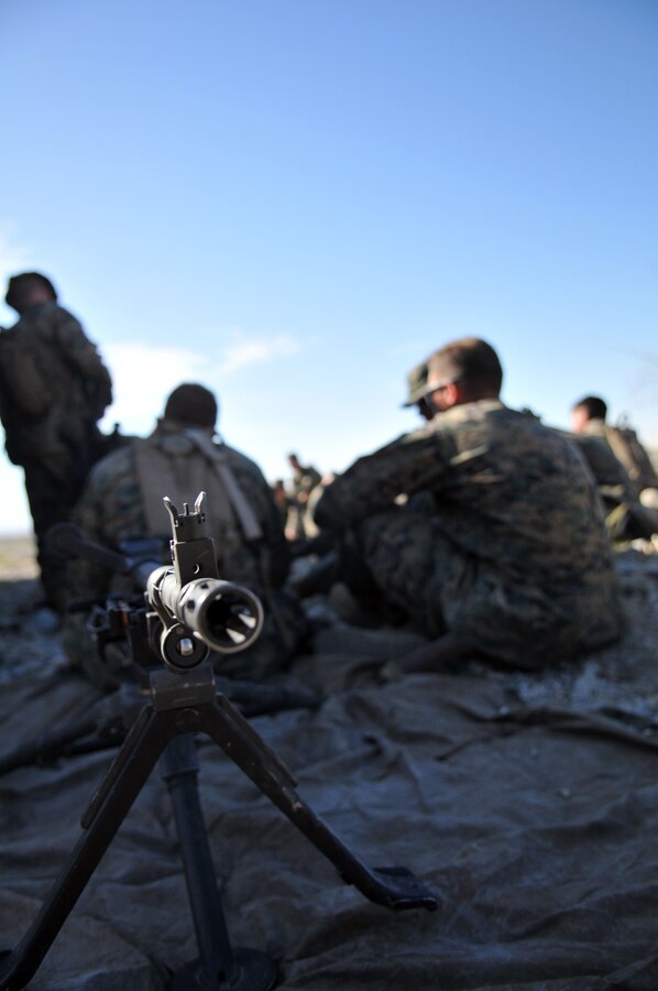 Marines from Company A, 1st Battalion, 2nd Marine Regiment, listen to instructors giving a class on medium and heavy machine guns at the Camp Billy Machen desert warfare training facility in the Chocolate Mountain Aerial Gunnery Range in California Oct. 18, 2009. The Camp Lejeune, N.C.-based company spent three days at the camp, making use of its rocky, mountainous terrain to prepare for an upcoming deployment to Afghanistan early next year.