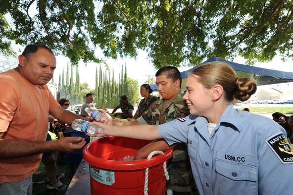 A U.S. Navy League Cadet Corps Seaman Apprentice hands out refreshments  during the annual March Air Reserve Base picnic as part of the Corps service detail. (U.S. Air Force photo taken by Staff Sgt. Erica J. Knight) 