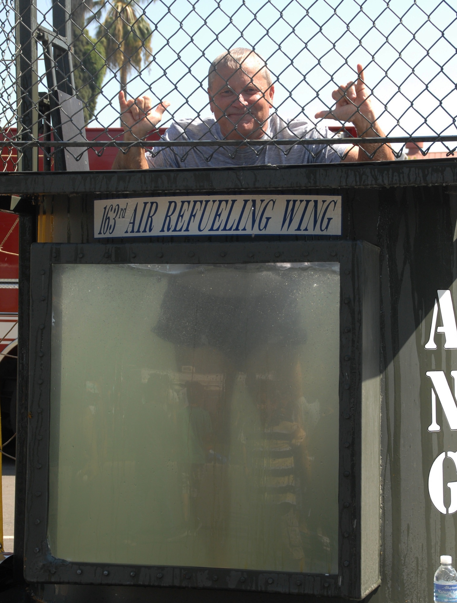 Brigadier General James Melin, commander of the 452 Air Mobility Wing, resurfaces after making a splash in the dunk tank during the annual picnic. (U.S. Air Force photo by Technical Sgt. Joe Zuccaro) 